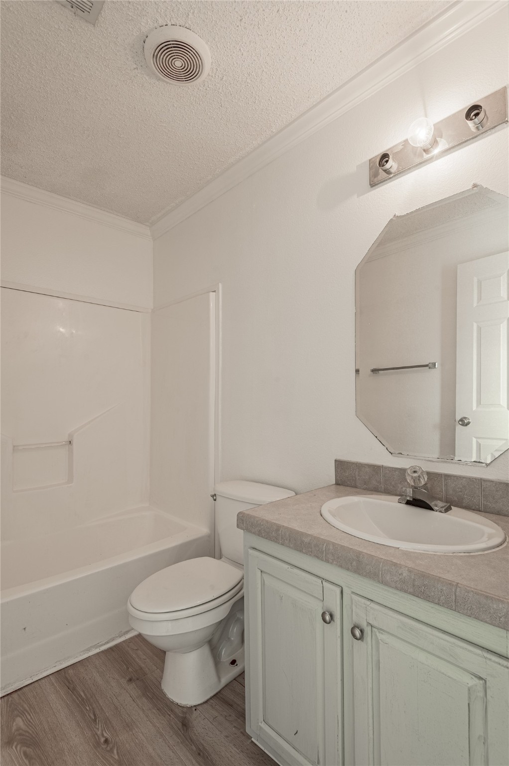 112 Varsity Circle Huntsville, TX 77340 - Photo 24 of 33 a bathroom with a sink a toilet and shower