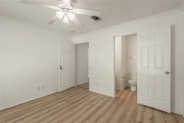 a bathroom with a toilet and a bathtub