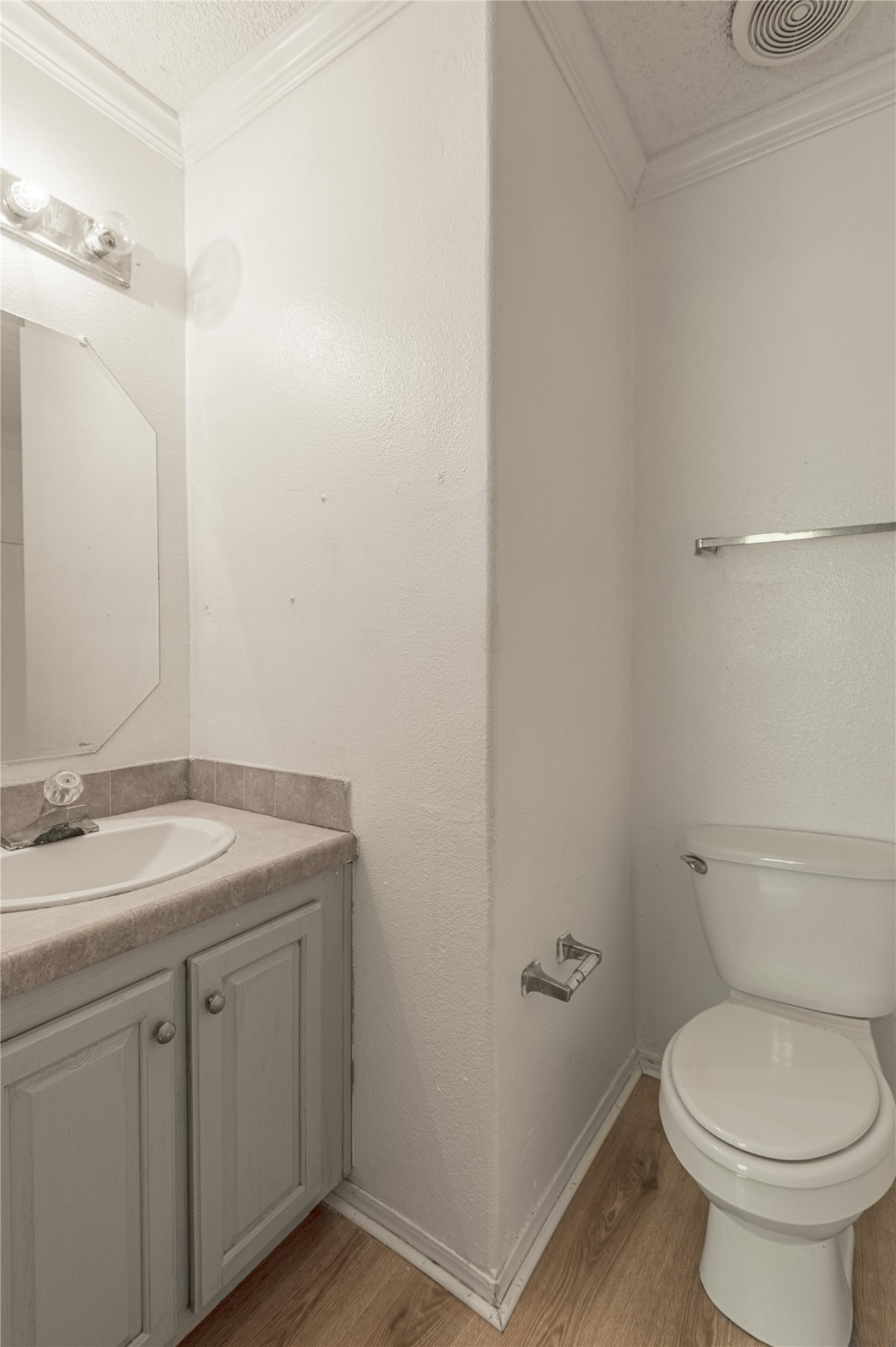 112 Varsity Circle Huntsville, TX 77340 - Photo 28 of 33 a bathroom with a granite countertop toilet and a sink