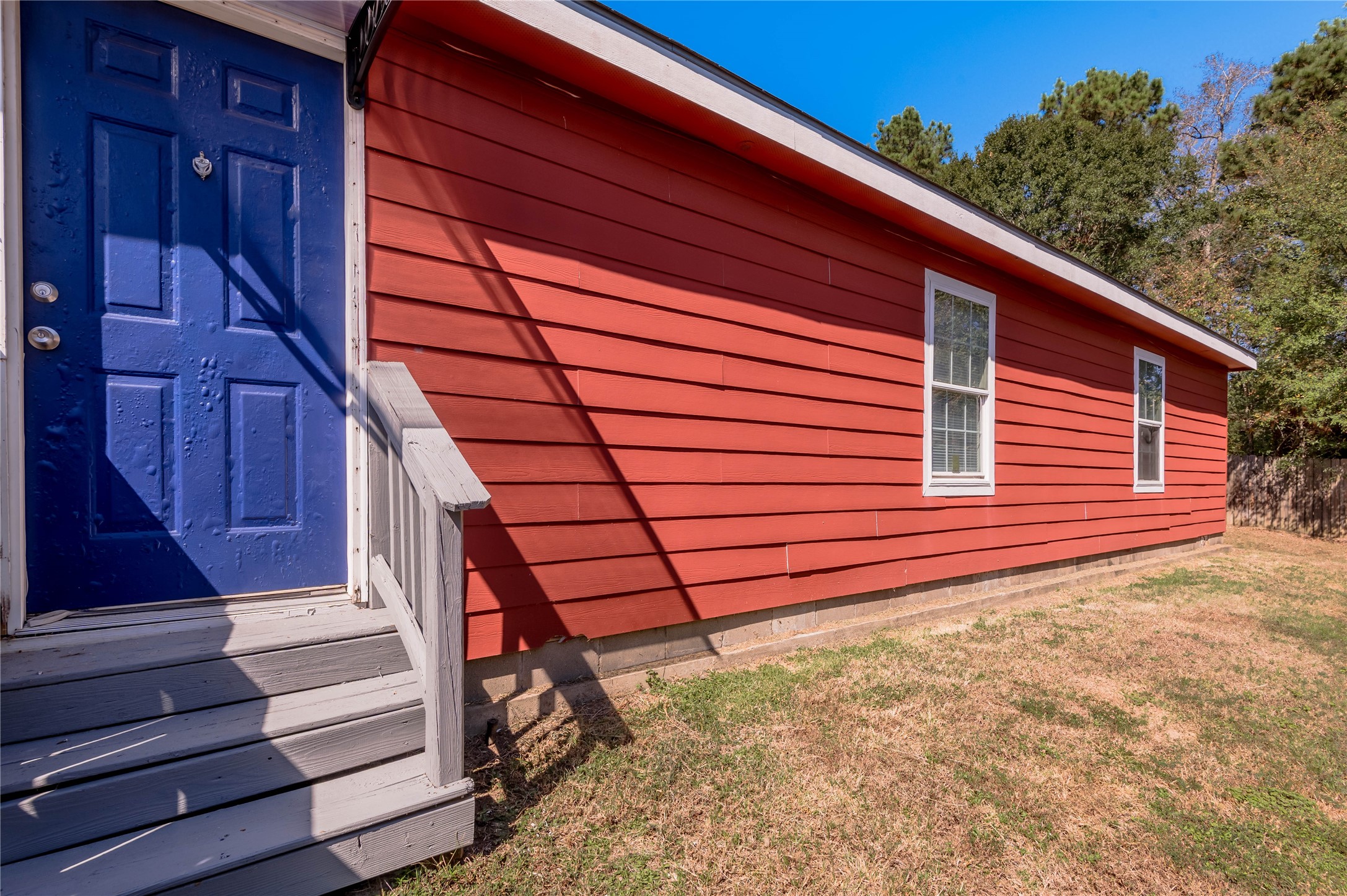 112 Varsity Circle Huntsville, TX 77340 - Photo 30 of 33 a view of a backyard with stairs and wooden stairs