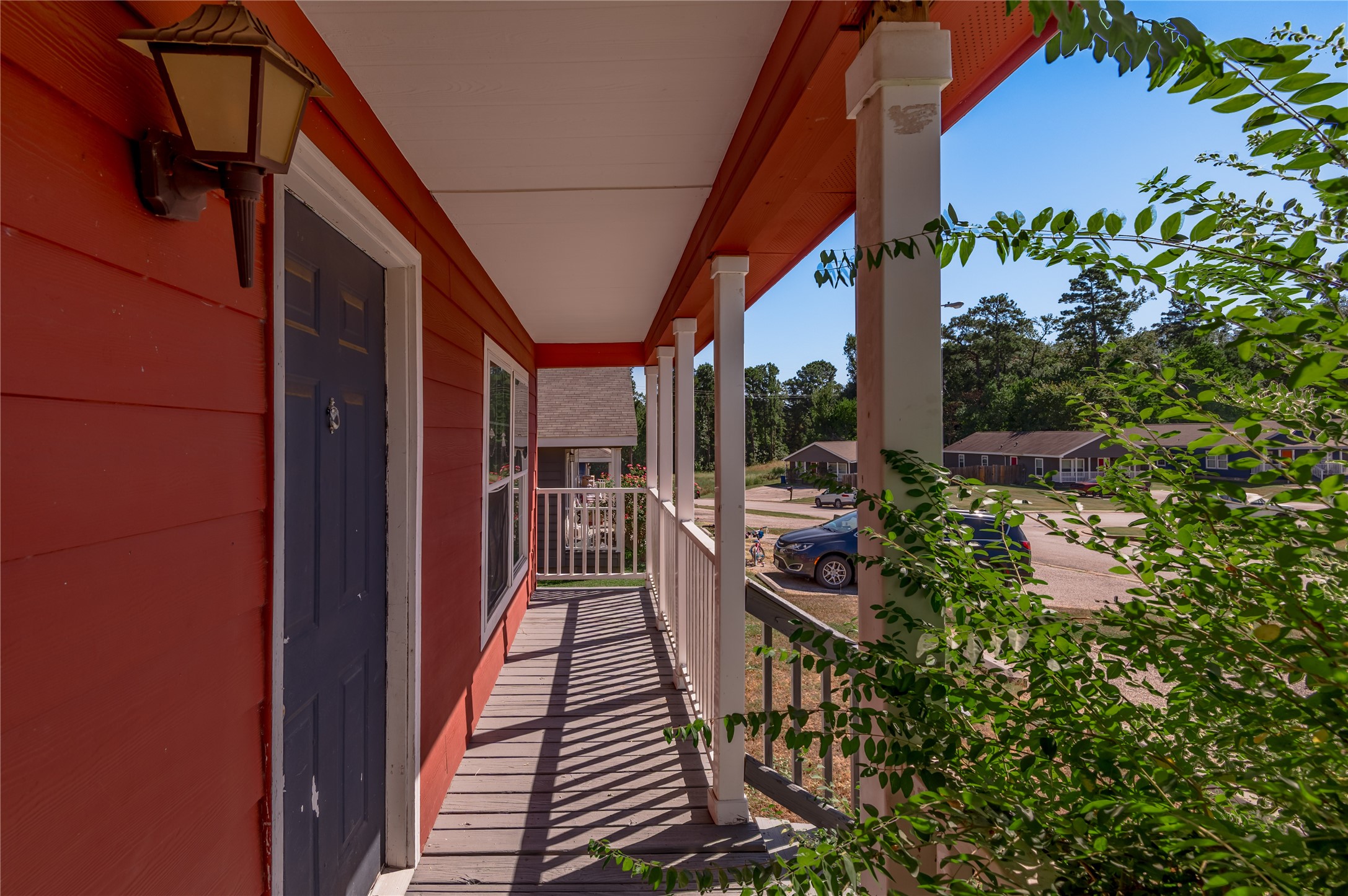 112 Varsity Circle Huntsville, TX 77340 - Photo 4 of 33 a balcony view with chairs and potted plants