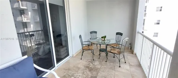 a view of a living room and floor to ceiling window or lake