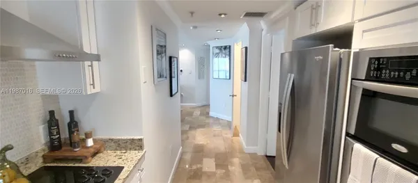 a view of a hallway with washer and dryer