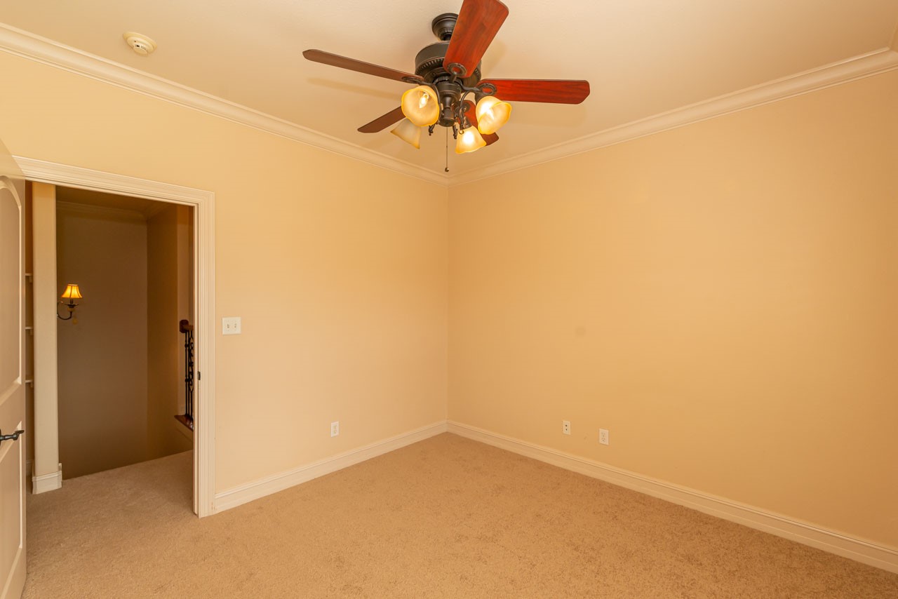 7 Stonebrook Court Beaumont, TX 77706 - Photo 24 of 35 a view of a room with a ceiling fan and a window
