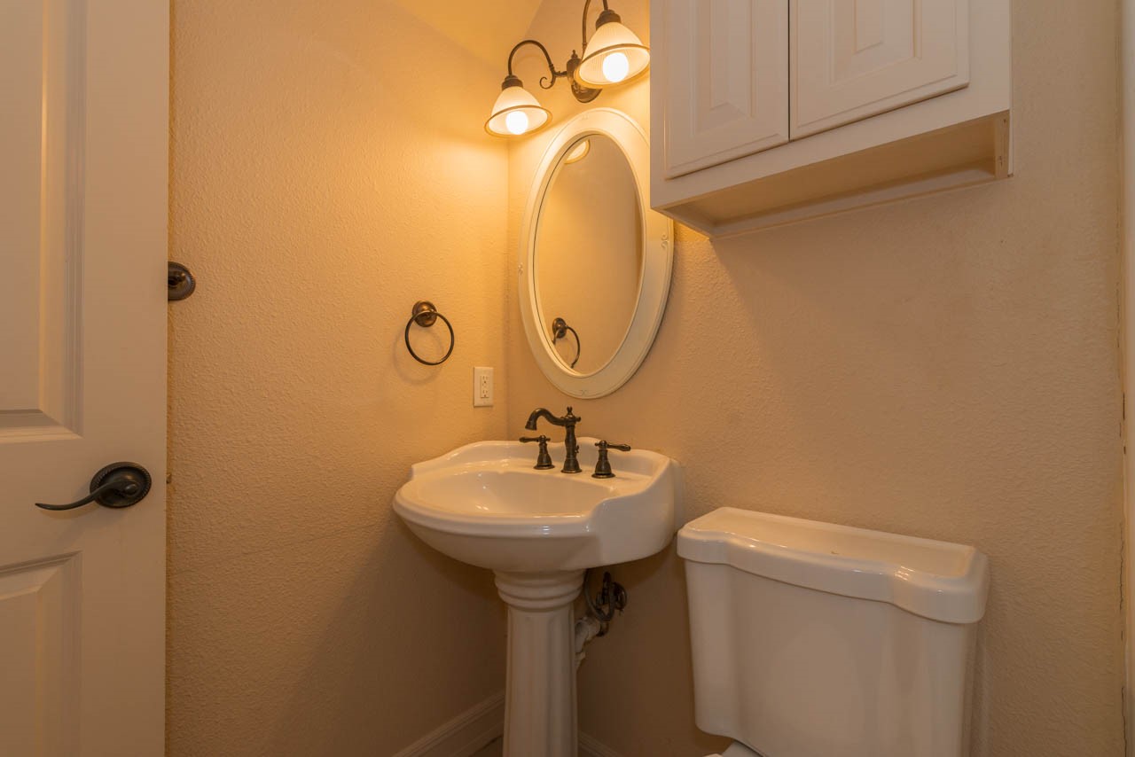 7 Stonebrook Court Beaumont, TX 77706 - Photo 27 of 35 a bathroom with a sink toilet and a mirror
