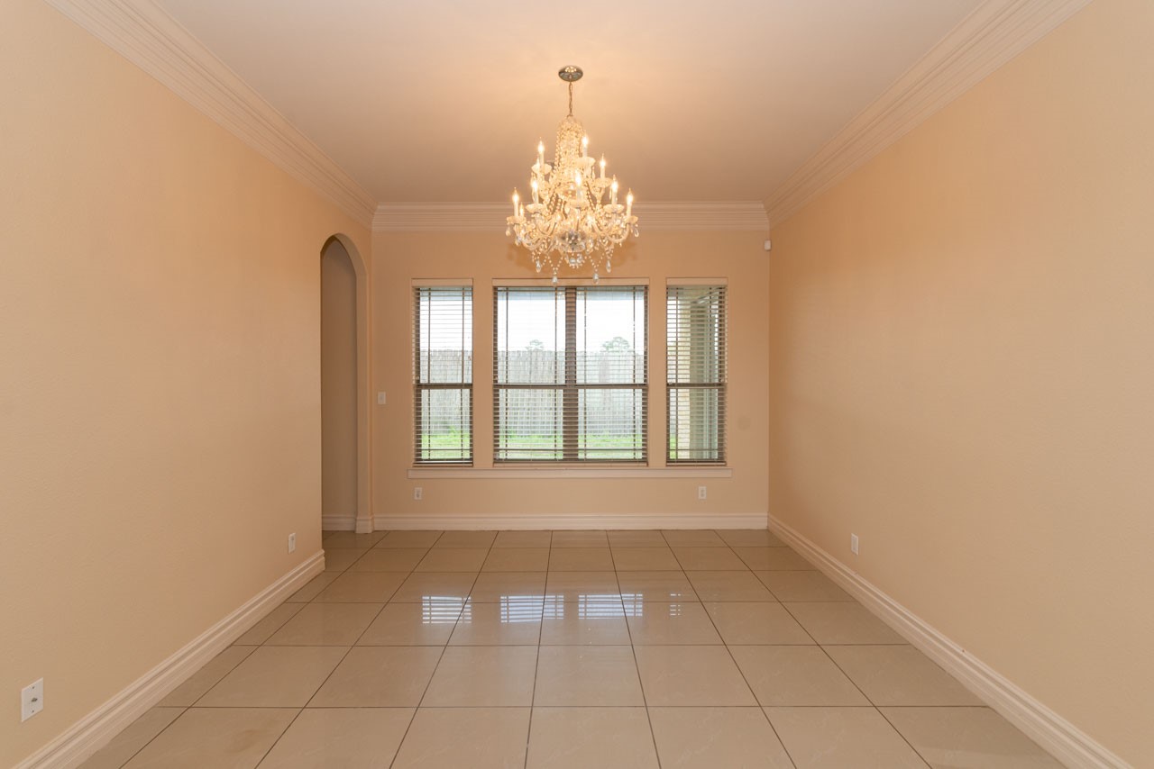 7 Stonebrook Court Beaumont, TX 77706 - Photo 6 of 35 a view of an empty room with a window