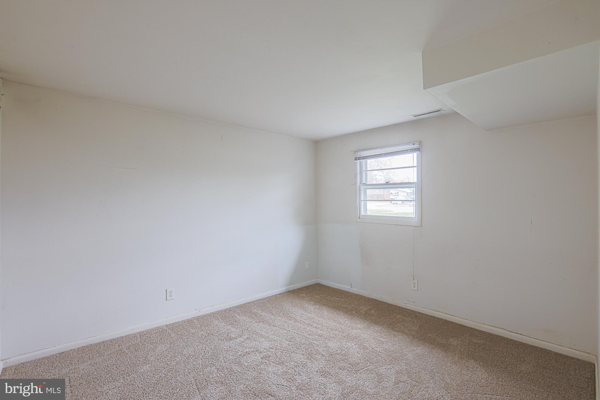 2607 Smith Avenue Baltimore, MD 21209 - Photo 10 of 14 an empty room with a window
