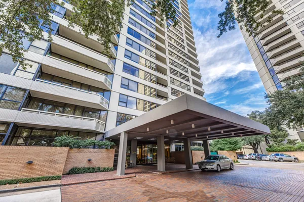 a view of a car park in front of building
