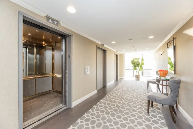 a view of a bathroom with a sink and a mirror