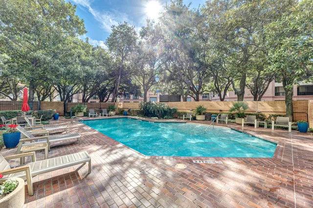 a view of a swimming pool with a lounge chairs