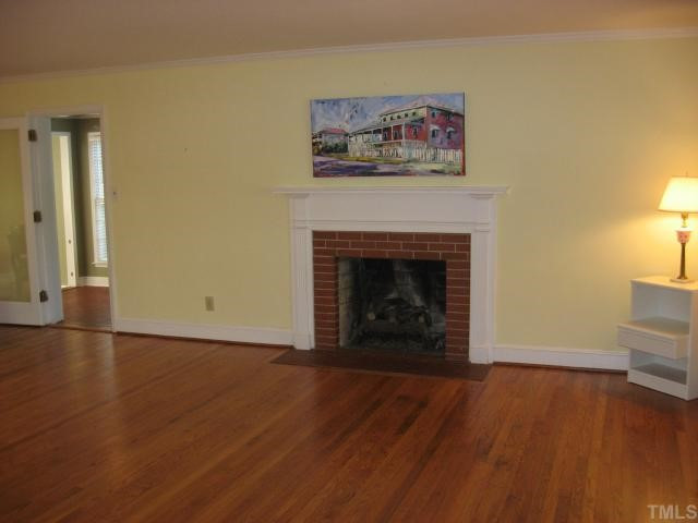 1318 Dogwood Lane Raleigh, NC 27607 - Photo 4 of 11 Family room with fireplace and mantel with gas logs