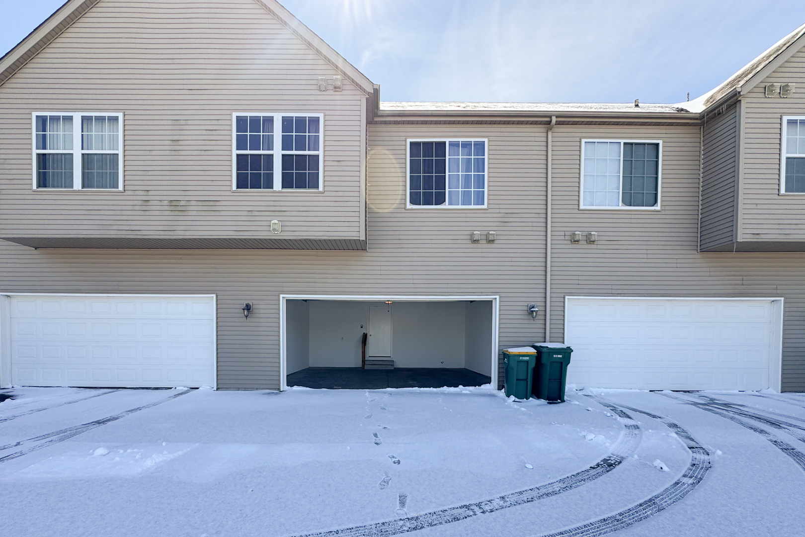 635 Stonegate Drive Sycamore, IL 60178 - Photo 18 of 19 a view of a house with a yard and garage