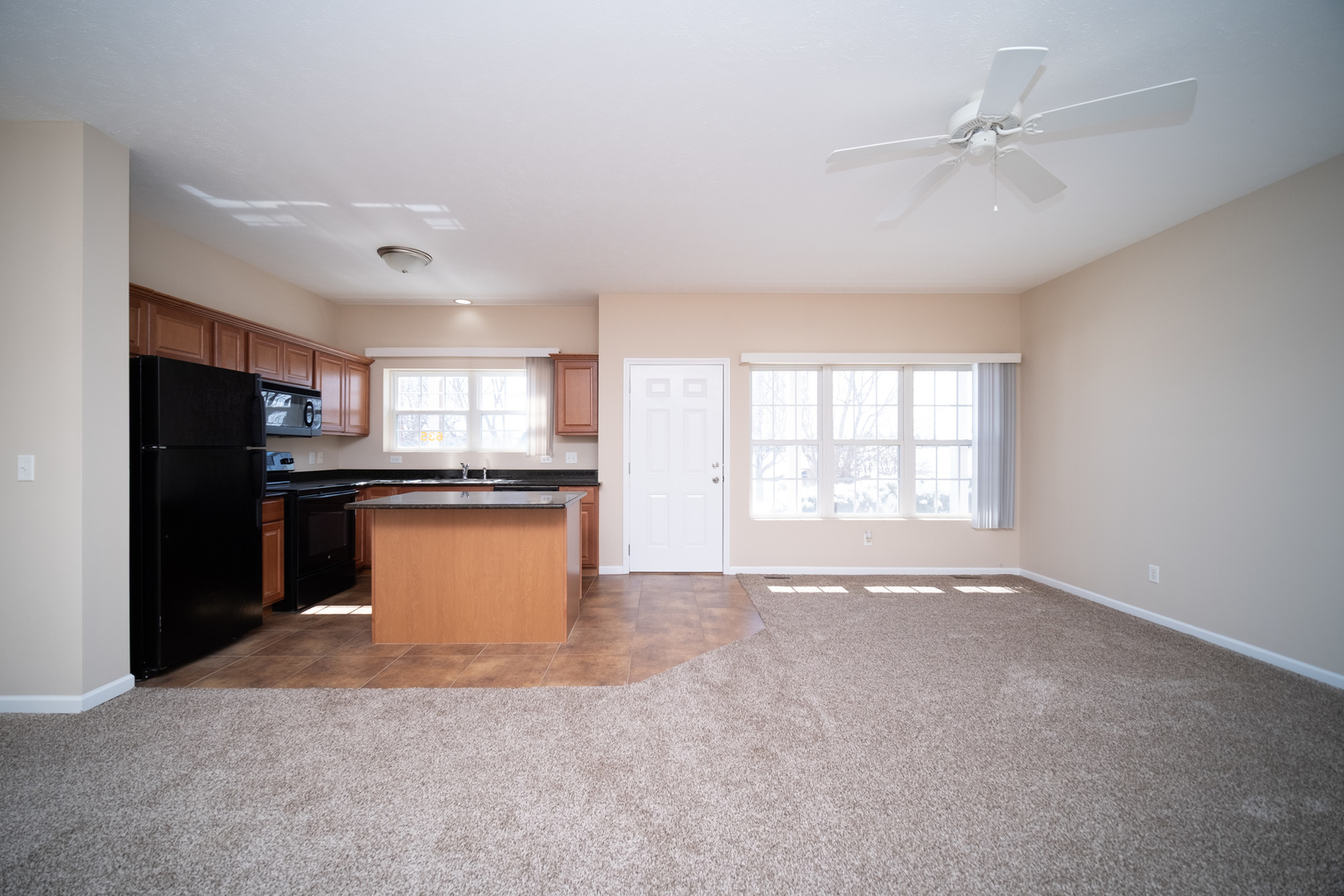 635 Stonegate Drive Sycamore, IL 60178 - Photo 4 of 19 a view of kitchen with refrigerator and window