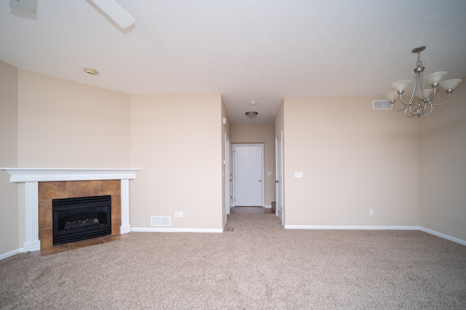635 Stonegate Drive Sycamore, IL 60178 - Photo 9 of 19 a view of an empty room with a fireplace