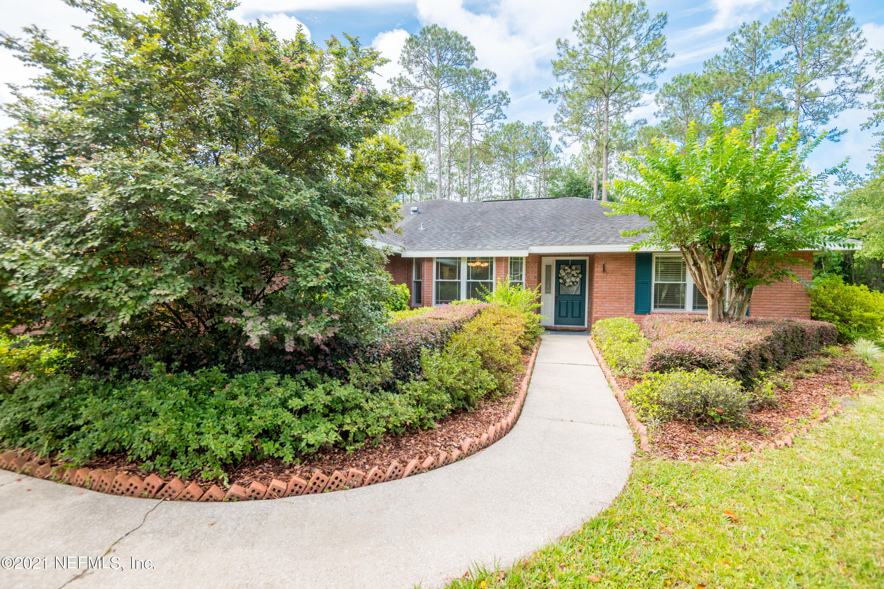 5200 Northwest 180th Way Starke, FL 32091 - Photo 1 of 83 front view of a house with a garden