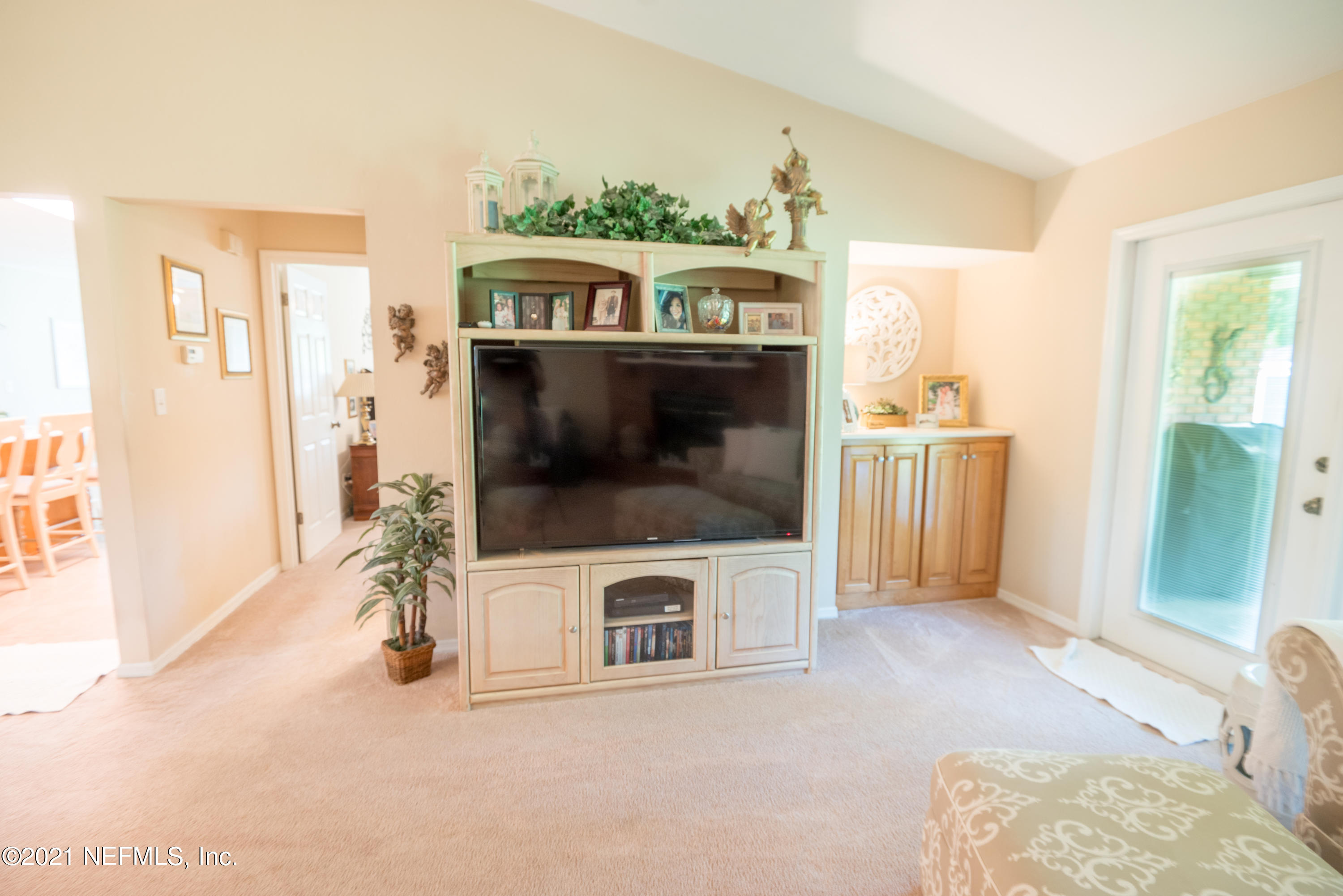 5200 Northwest 180th Way Starke, FL 32091 - Photo 13 of 83 a living room with furniture and a flat screen tv