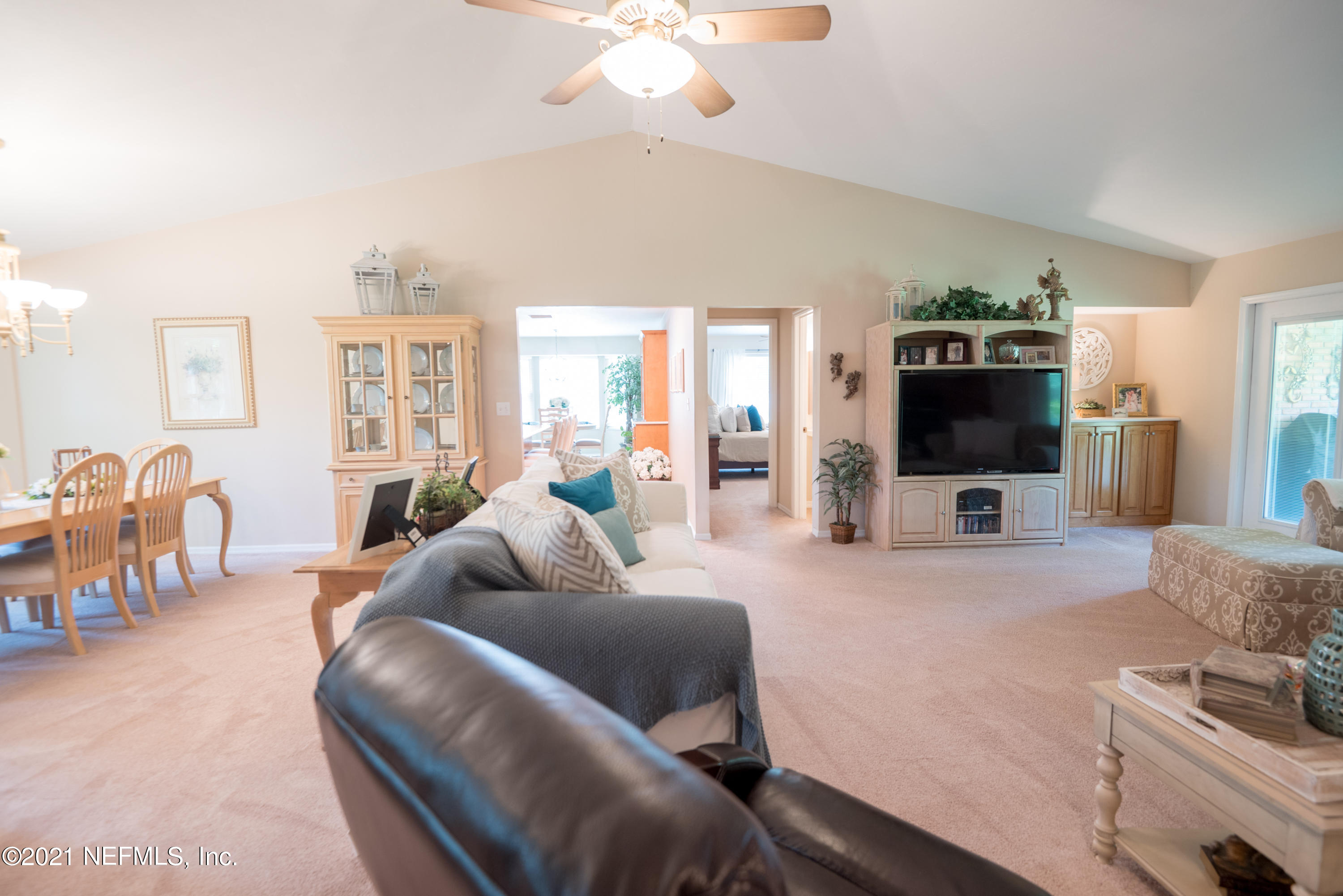 5200 Northwest 180th Way Starke, FL 32091 - Photo 14 of 83 a living room with furniture and a flat screen tv