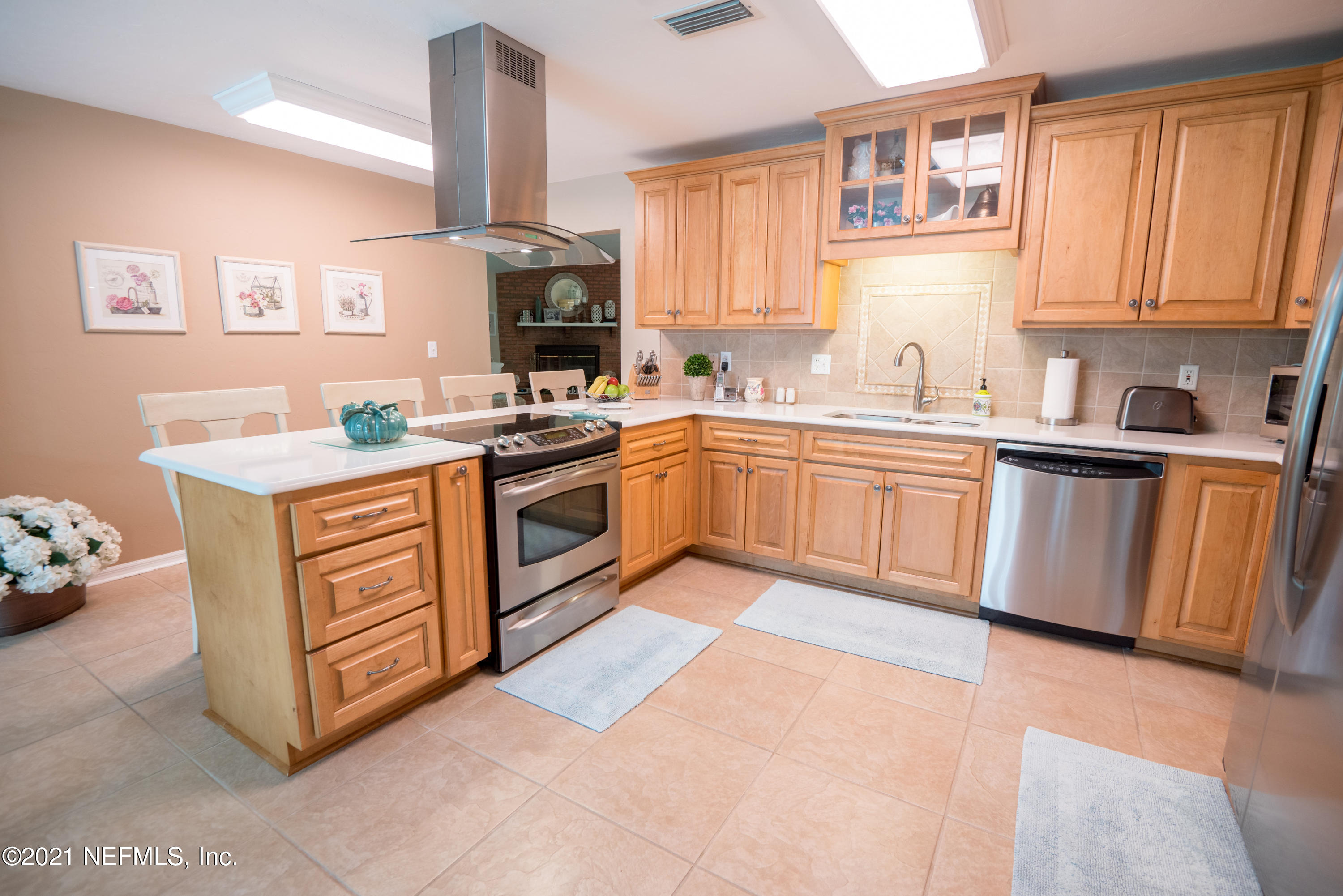 5200 Northwest 180th Way Starke, FL 32091 - Photo 17 of 83 a kitchen with a stove sink and cabinets