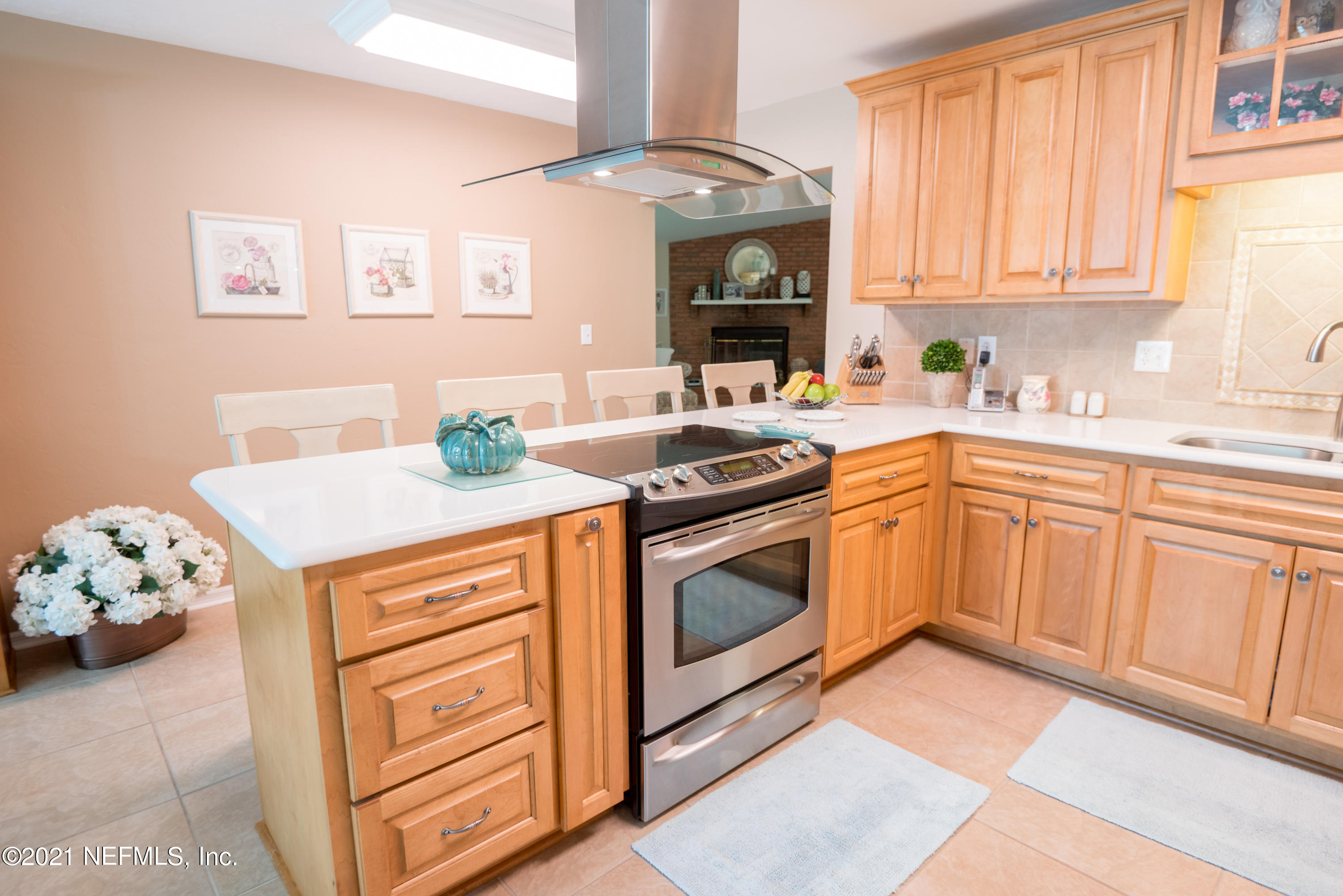 5200 Northwest 180th Way Starke, FL 32091 - Photo 18 of 83 a kitchen with stainless steel appliances granite countertop a stove a sink and a microwave