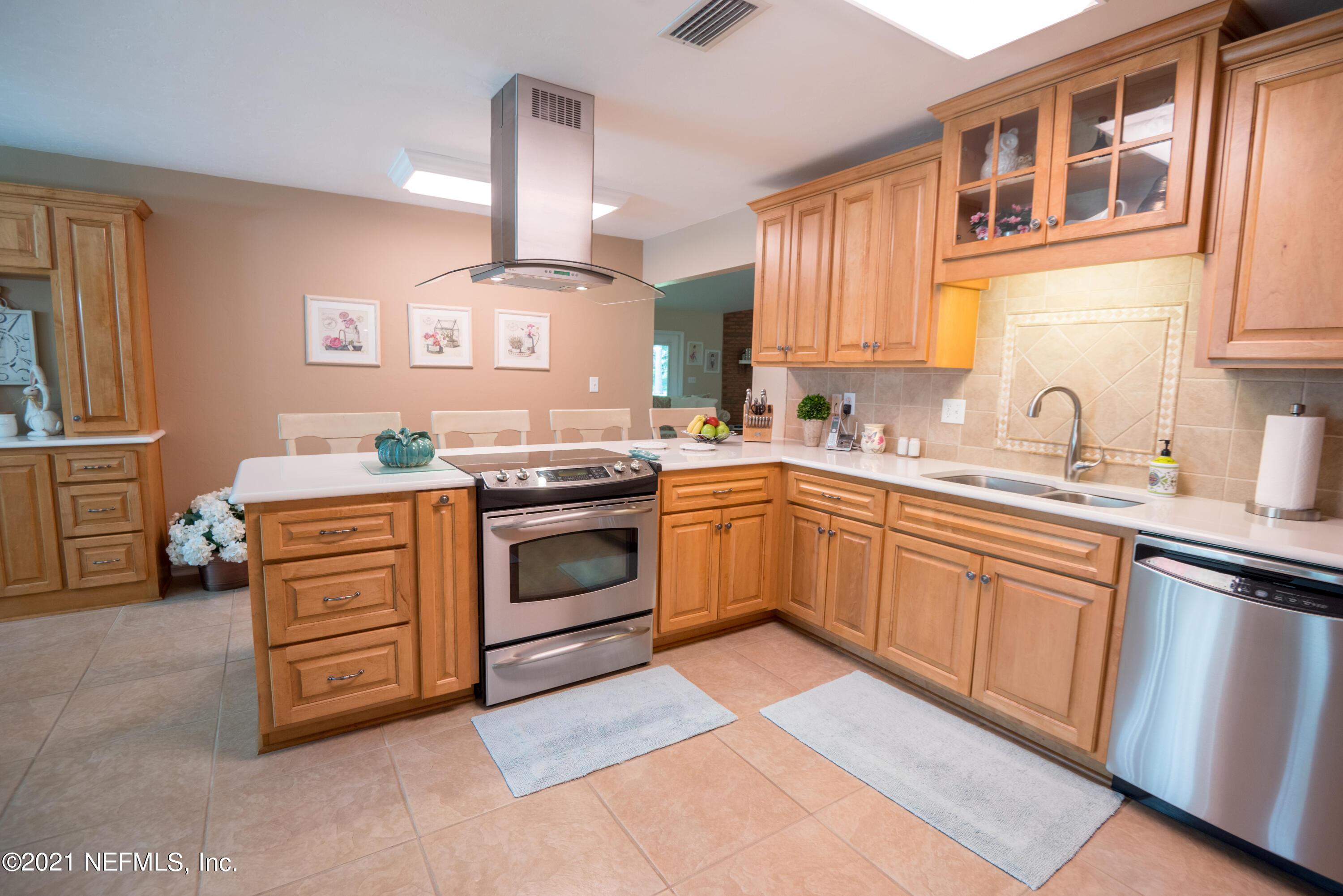 5200 Northwest 180th Way Starke, FL 32091 - Photo 20 of 83 a kitchen with a stove sink and a microwave