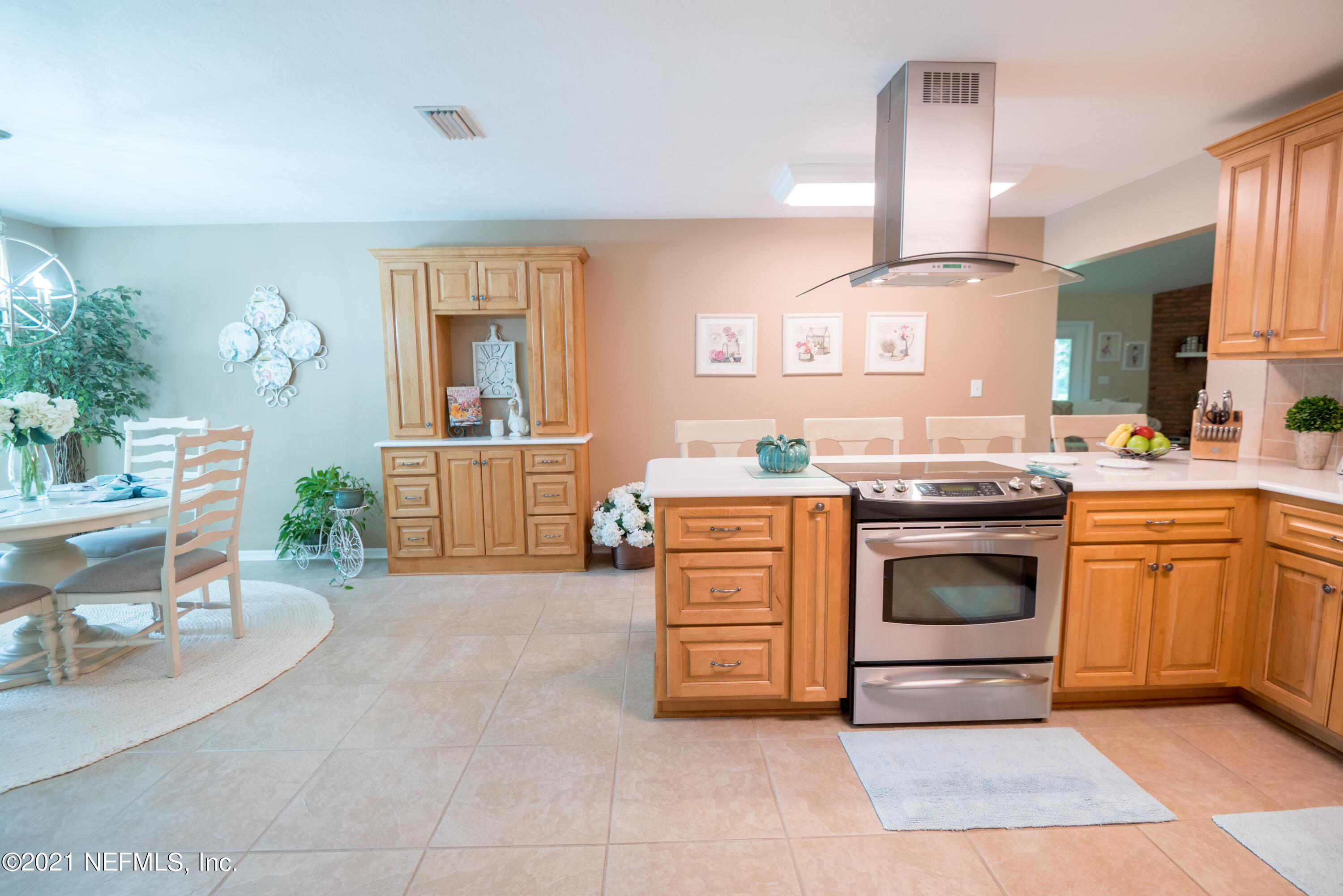 5200 Northwest 180th Way Starke, FL 32091 - Photo 21 of 83 a kitchen with stainless steel appliances a stove top oven and a refrigerator