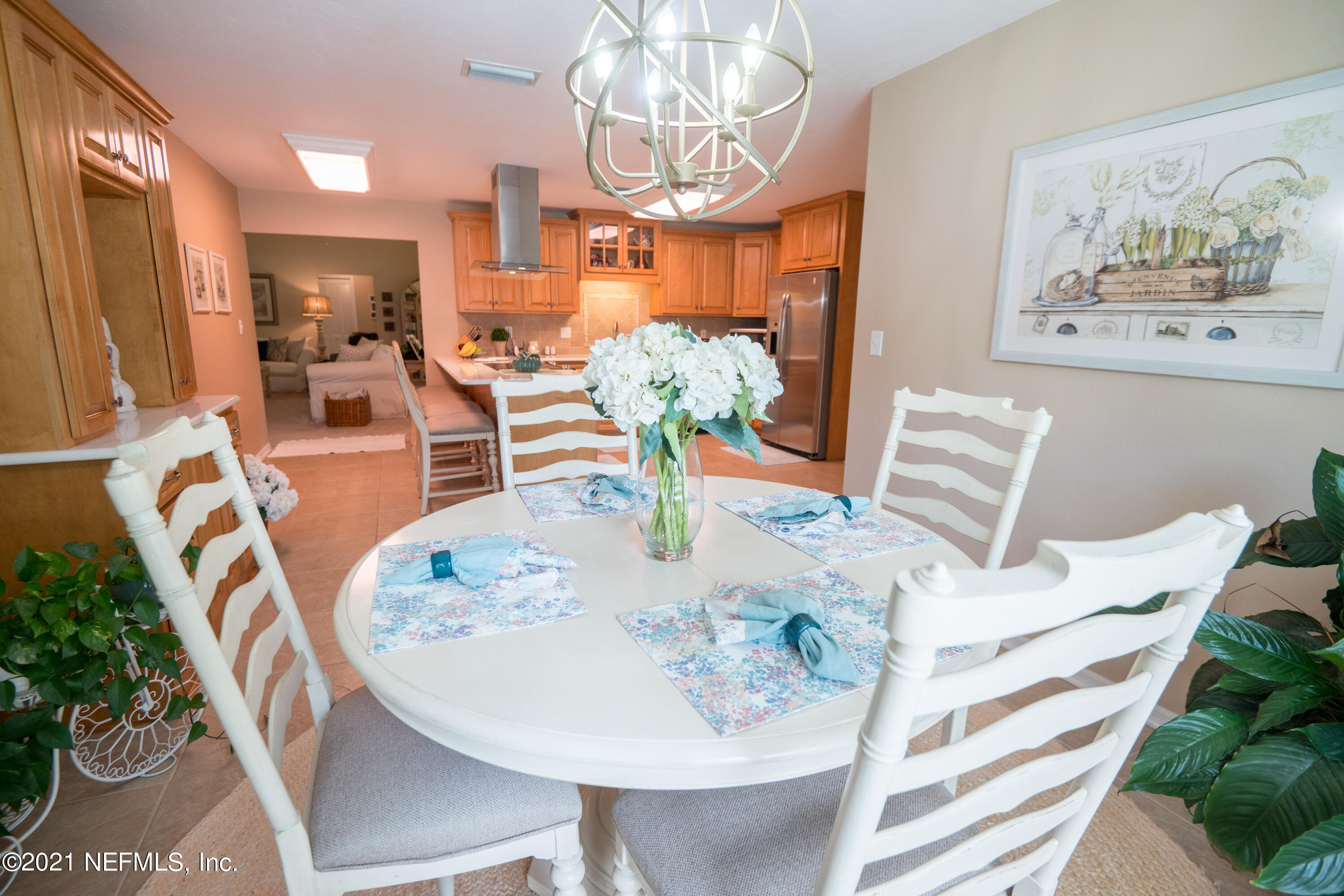 5200 Northwest 180th Way Starke, FL 32091 - Photo 24 of 83 a view of a dining room with furniture a potted plant and wooden floor