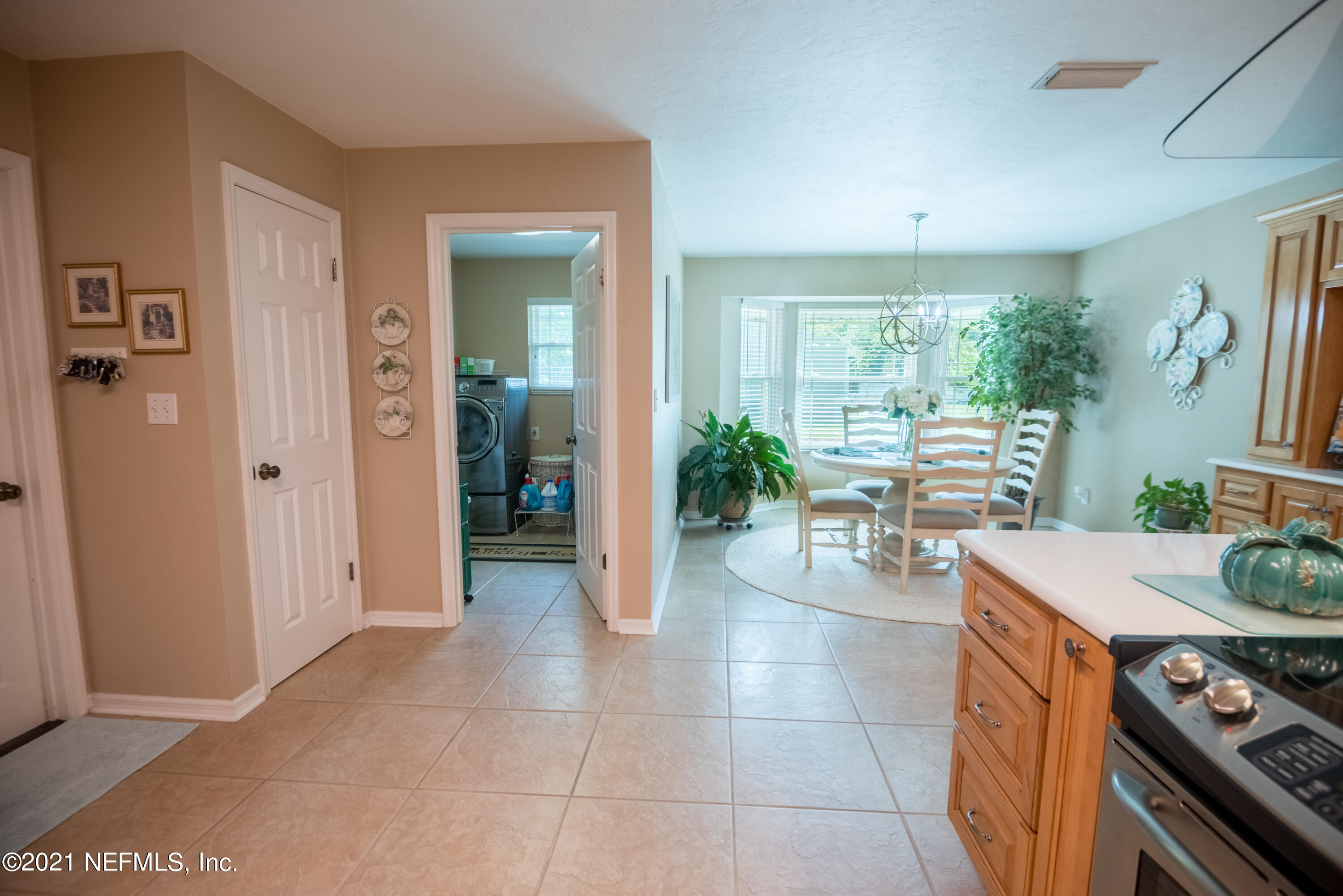5200 Northwest 180th Way Starke, FL 32091 - Photo 27 of 83 a view of a kitchen with furniture and large windows