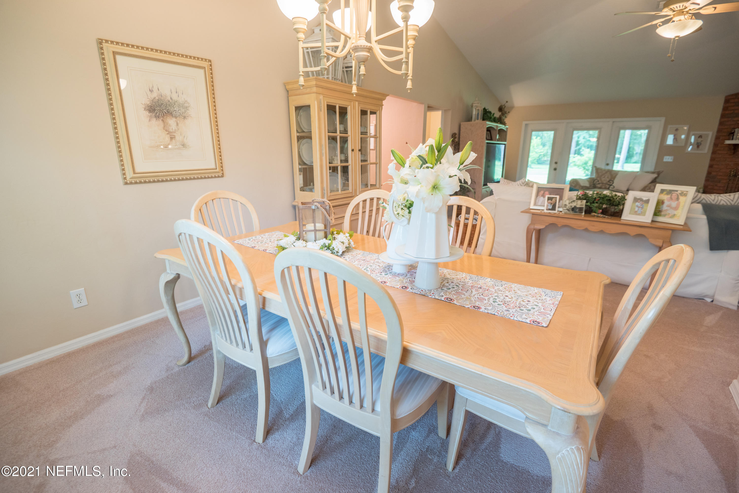 5200 Northwest 180th Way Starke, FL 32091 - Photo 4 of 83 a view of a dining room with furniture a chandelier and wooden floor