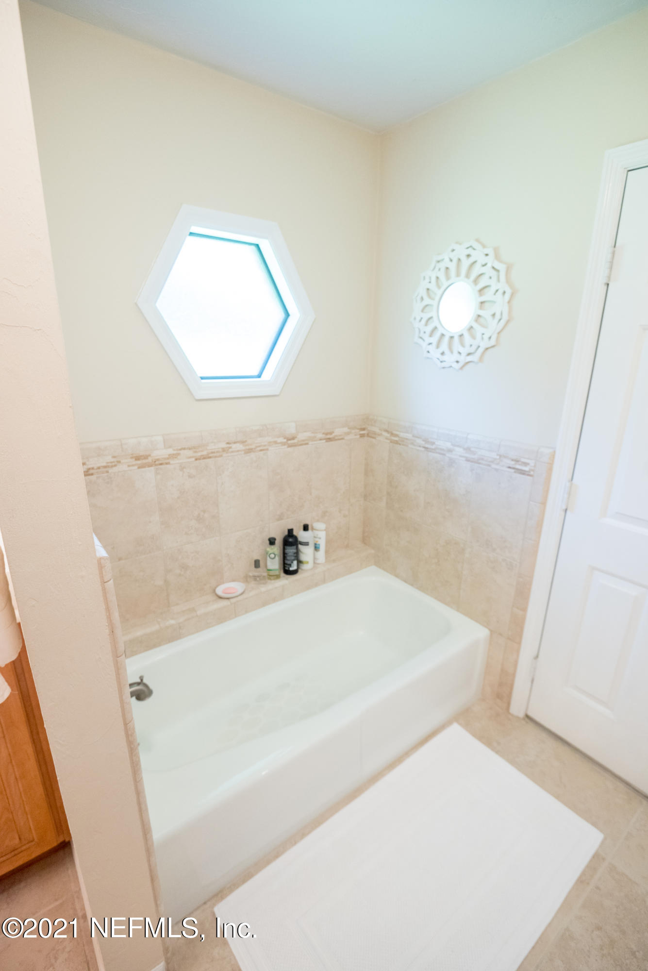 5200 Northwest 180th Way Starke, FL 32091 - Photo 42 of 83 a bathroom with a sink and a mirror