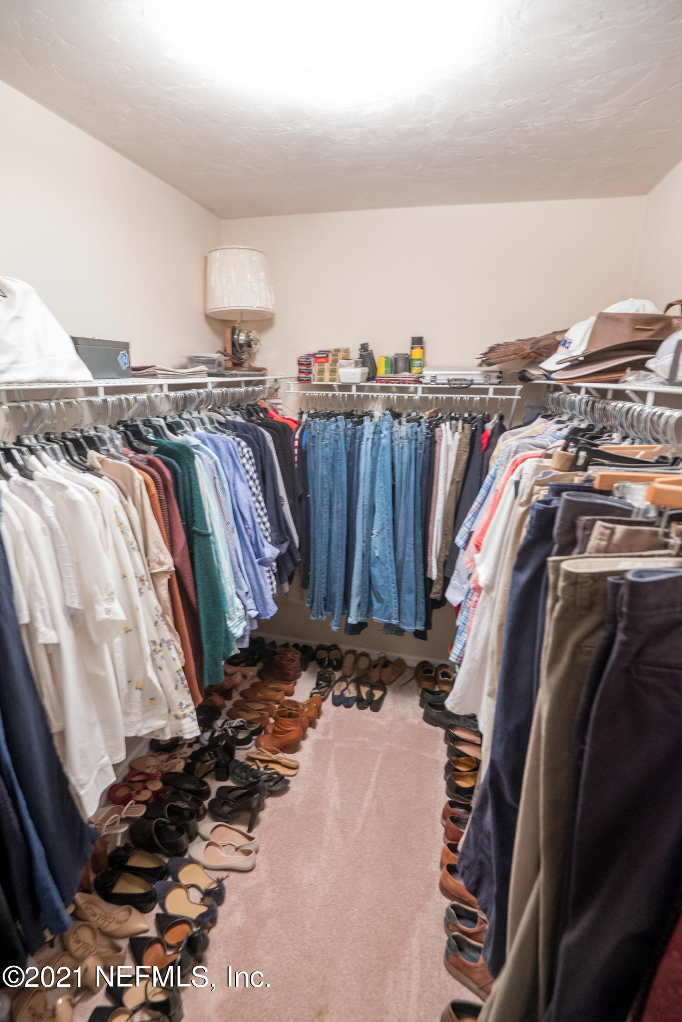 5200 Northwest 180th Way Starke, FL 32091 - Photo 47 of 83 a view of walk in closet with clothes and shoes