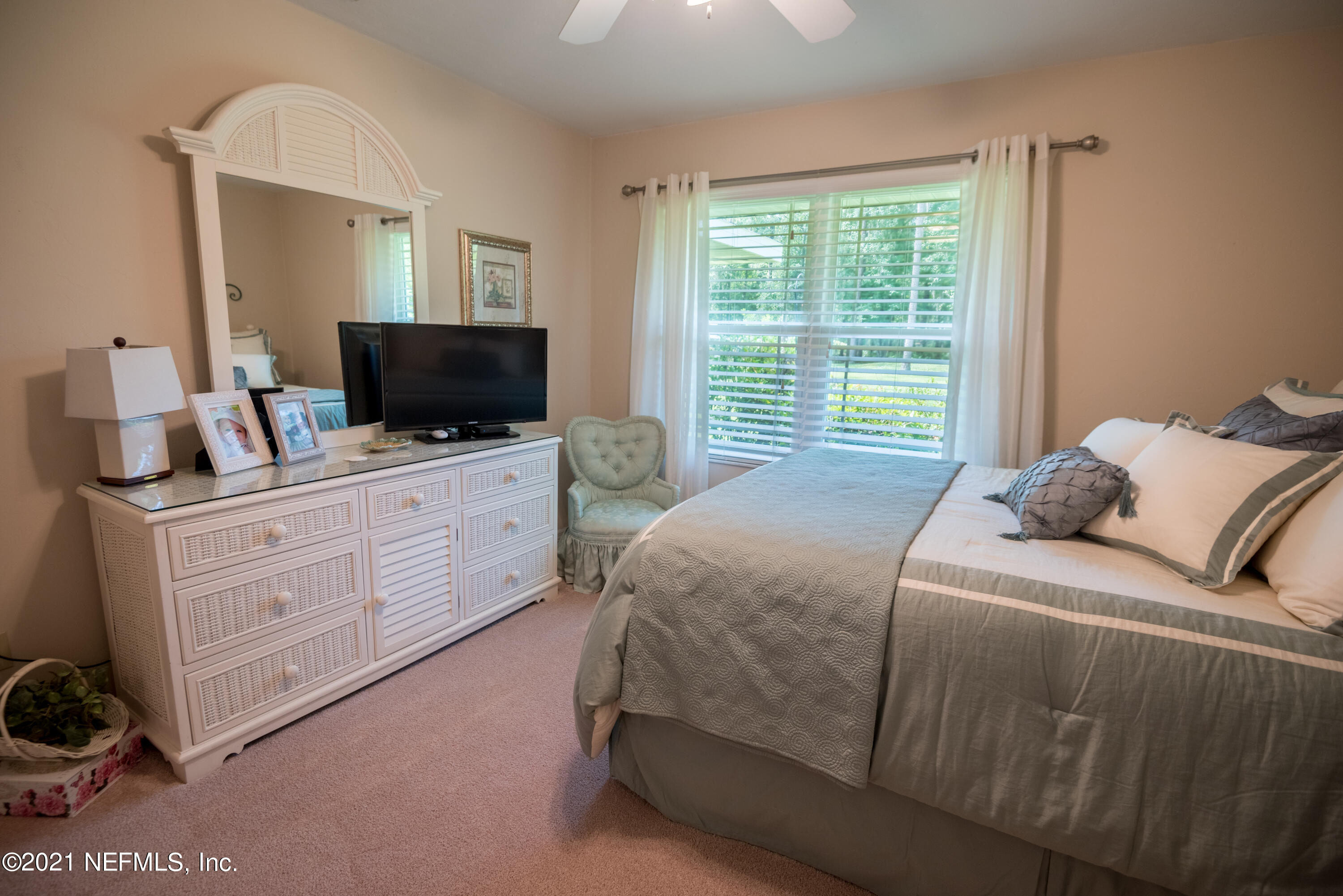 5200 Northwest 180th Way Starke, FL 32091 - Photo 49 of 83 a bedroom with a bed and a flat screen tv