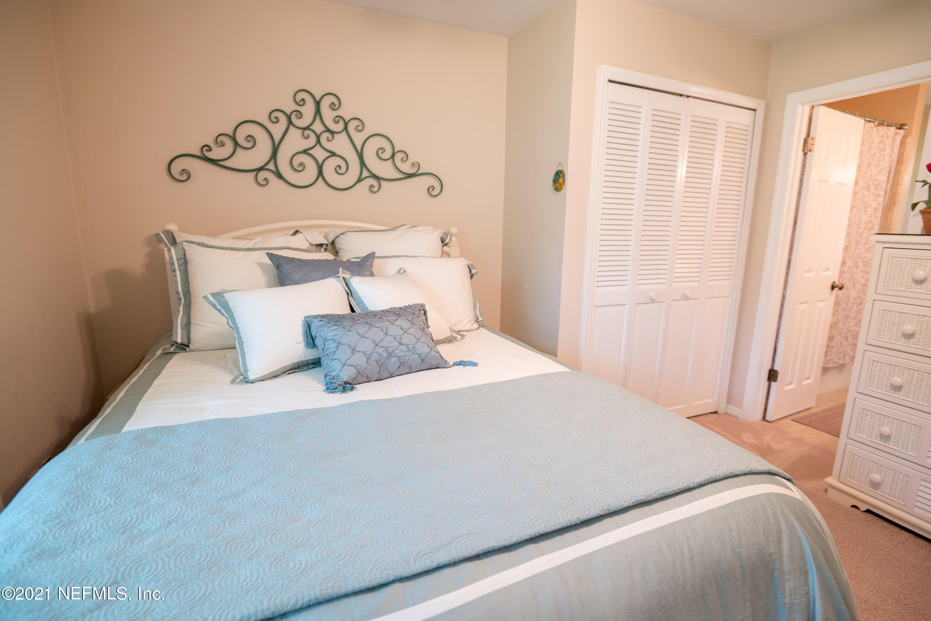 5200 Northwest 180th Way Starke, FL 32091 - Photo 50 of 83 a bedroom with a bed and painting on the wall