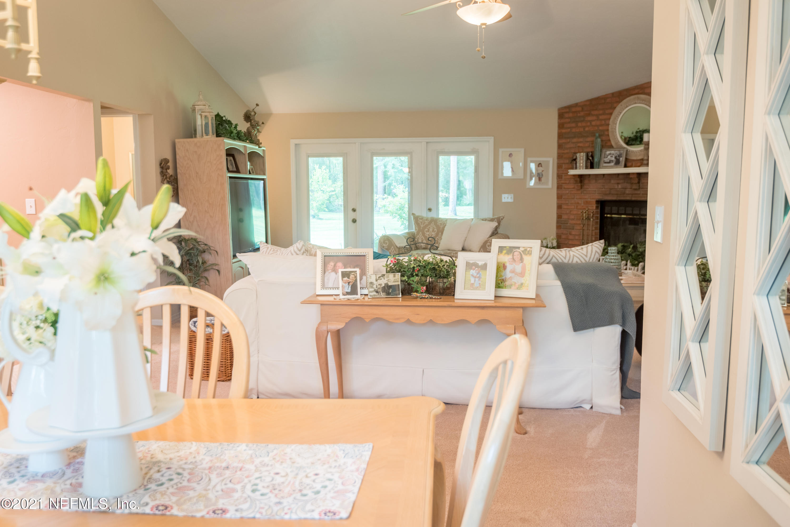 5200 Northwest 180th Way Starke, FL 32091 - Photo 5 of 83 a living room with furniture fireplace and a large window
