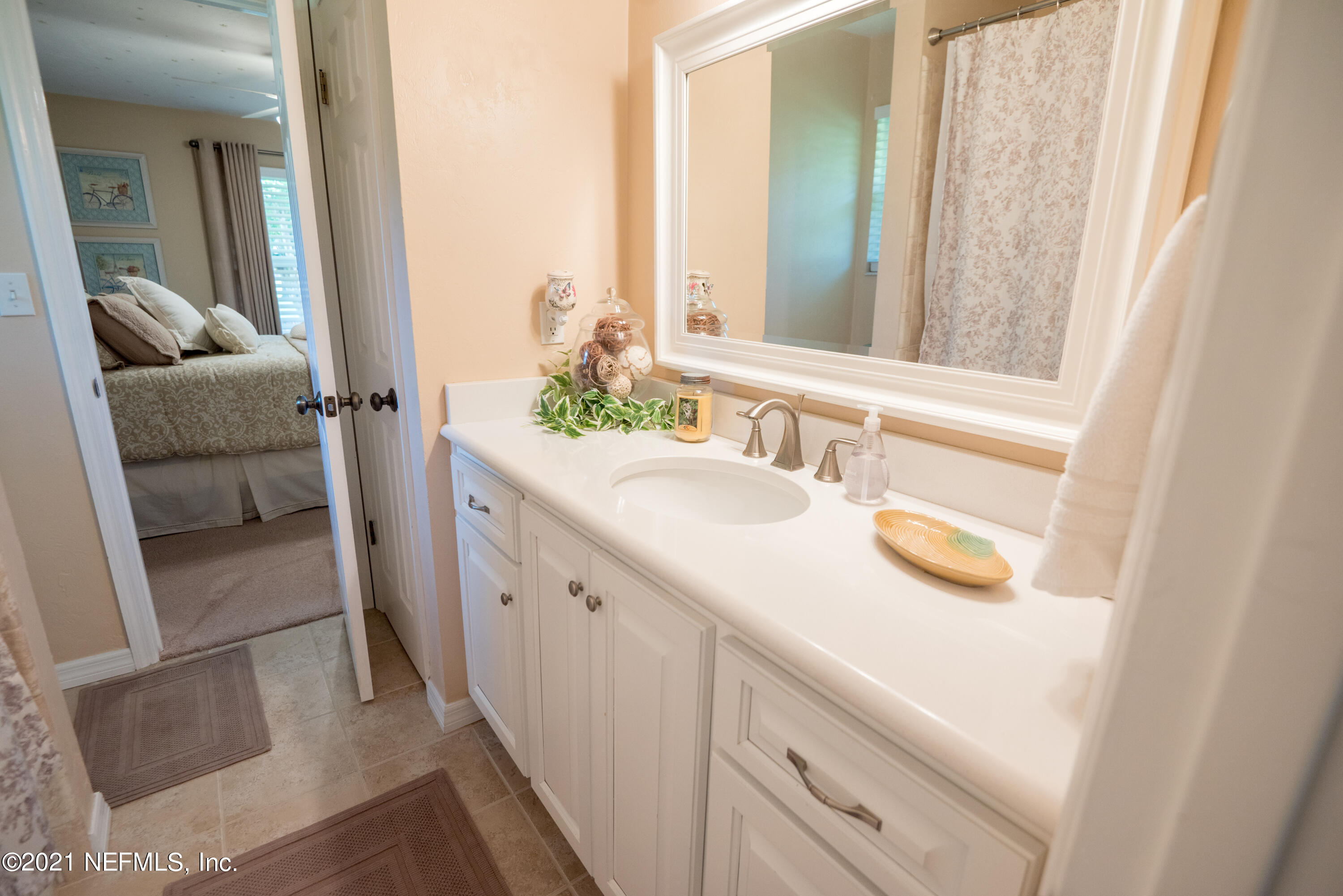 5200 Northwest 180th Way Starke, FL 32091 - Photo 53 of 83 a bathroom with a sink and a mirror