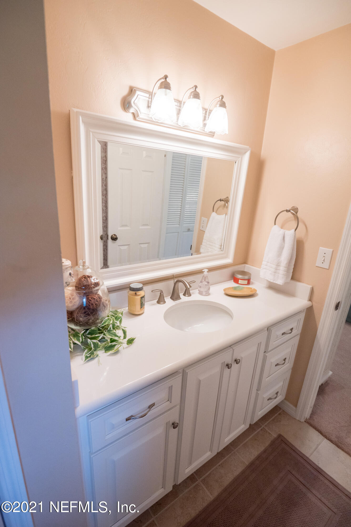 5200 Northwest 180th Way Starke, FL 32091 - Photo 56 of 83 a bathroom with a sink and a mirror
