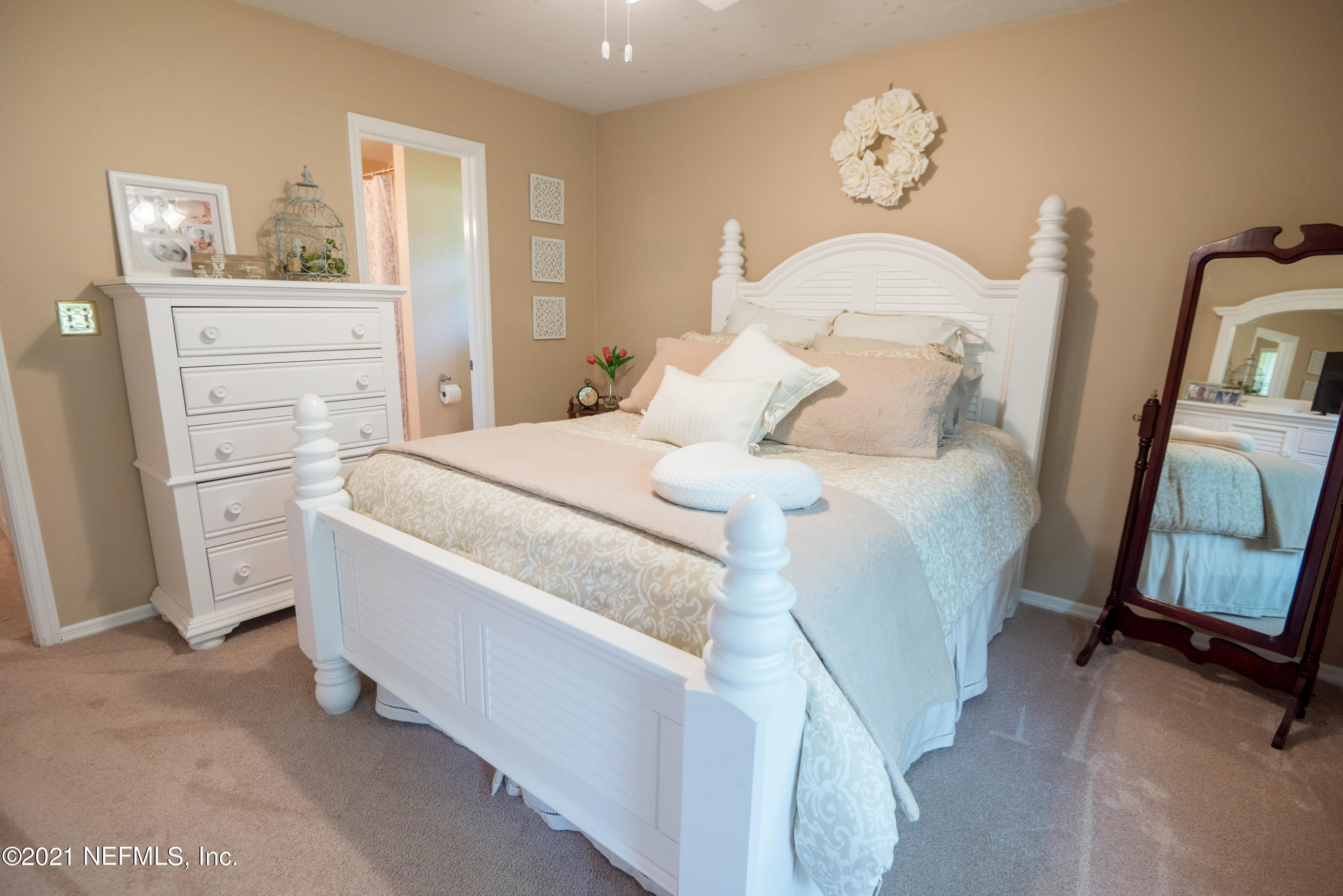 5200 Northwest 180th Way Starke, FL 32091 - Photo 60 of 83 a room with a bed and a mirror