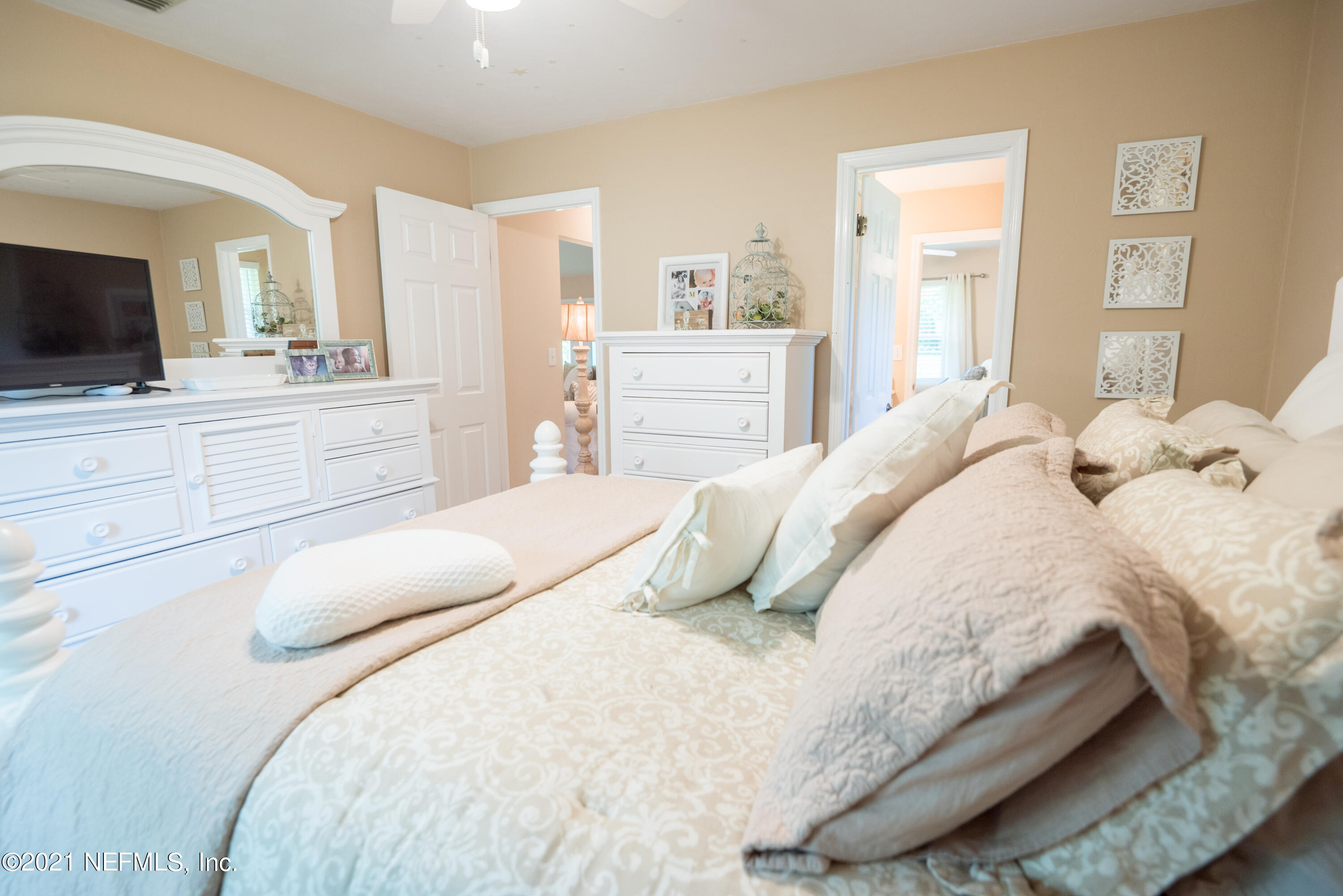 5200 Northwest 180th Way Starke, FL 32091 - Photo 62 of 83 a bedroom with a bed and a flat screen tv