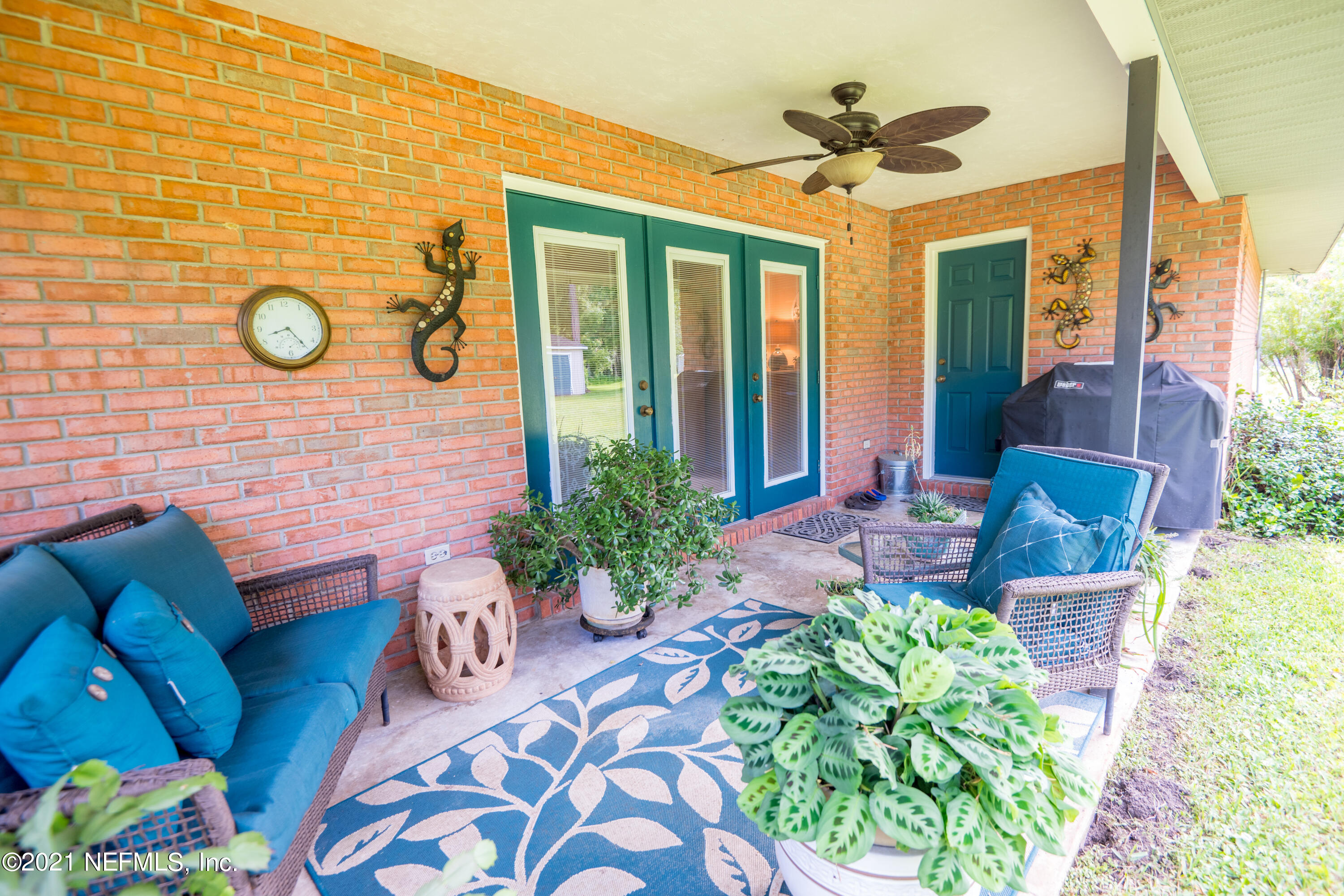 5200 Northwest 180th Way Starke, FL 32091 - Photo 64 of 83 a front view of a house with a chairs and a potted plant