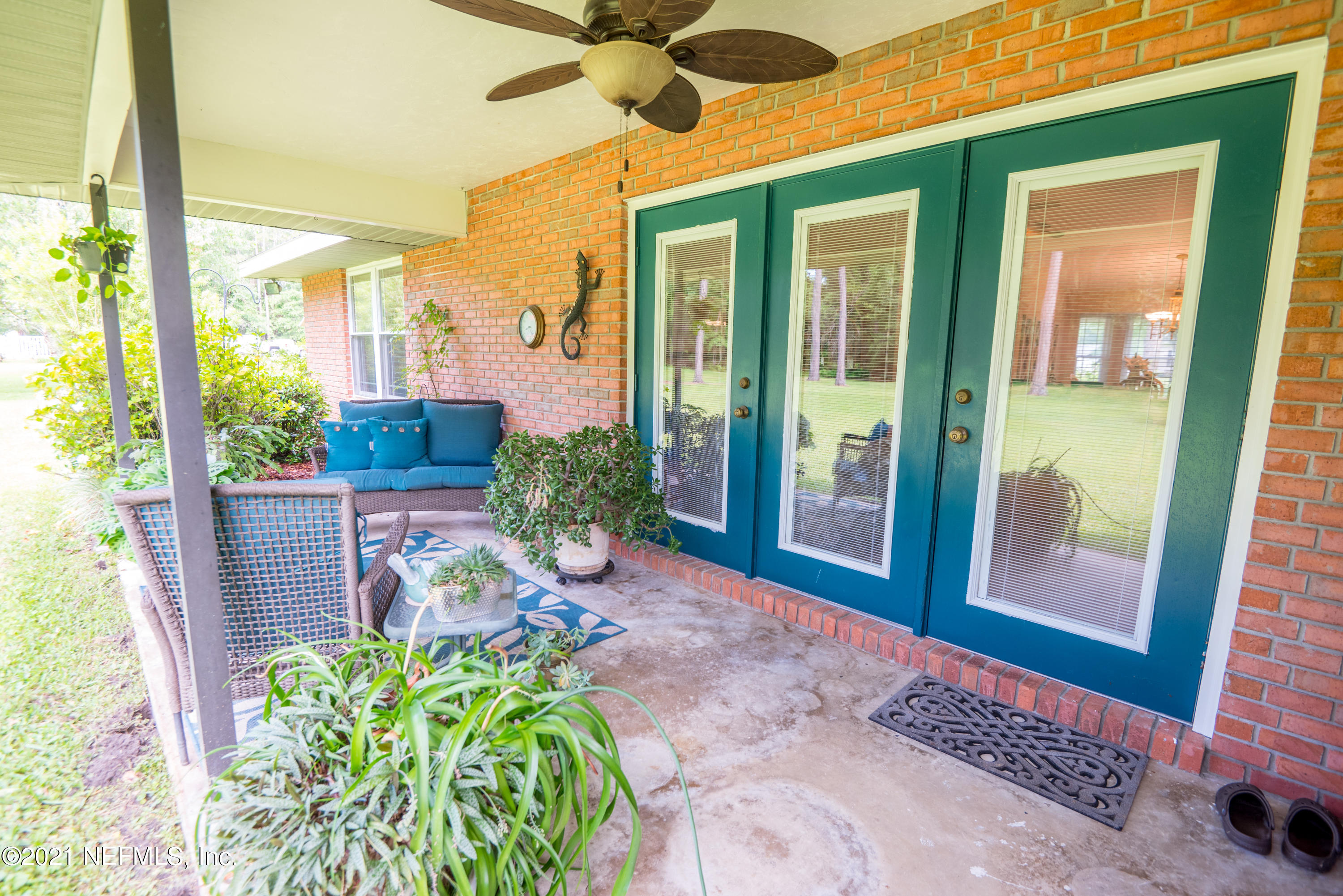 5200 Northwest 180th Way Starke, FL 32091 - Photo 65 of 83 a porch with seating space