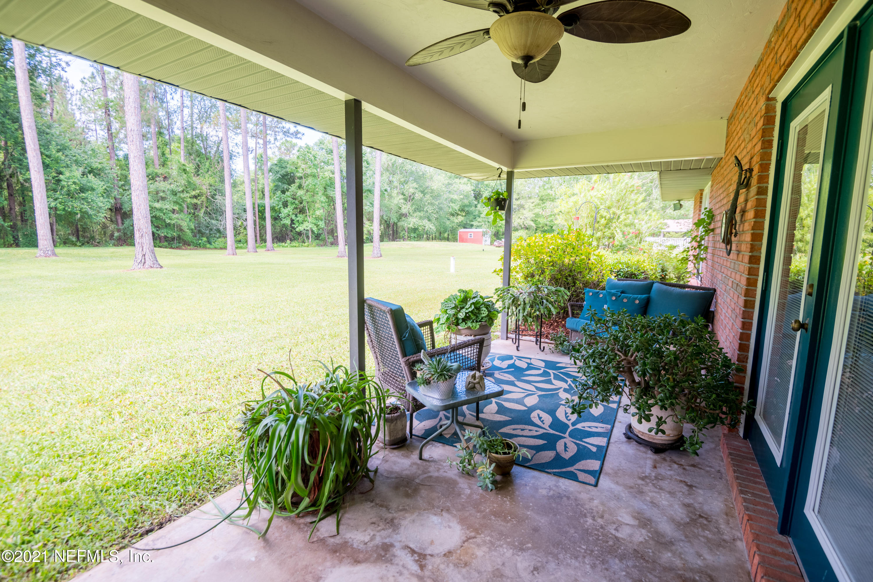 5200 Northwest 180th Way Starke, FL 32091 - Photo 66 of 83 a outdoor living space with furniture and garden view