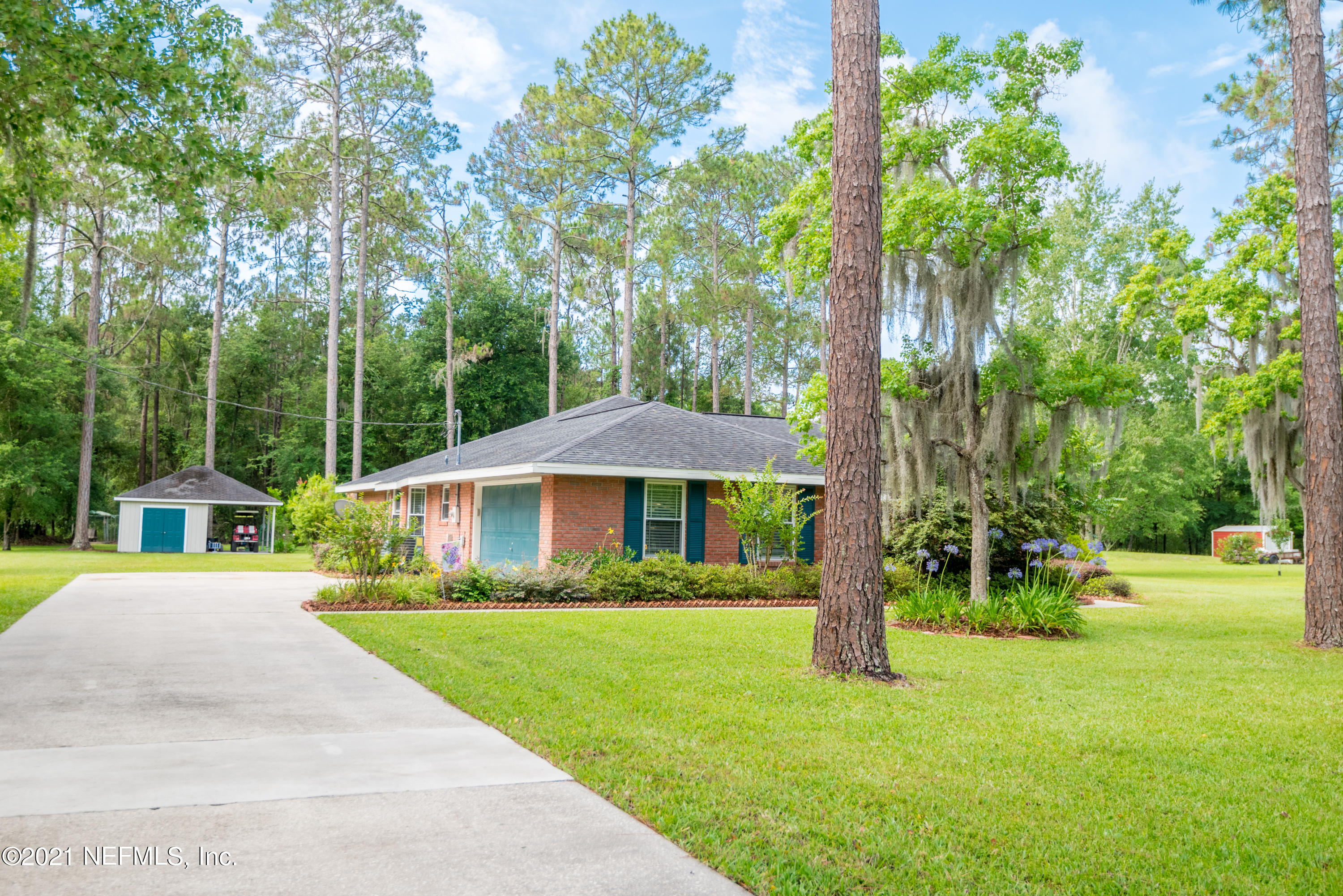 5200 Northwest 180th Way Starke, FL 32091 - Photo 70 of 83 a front view of a house with garden