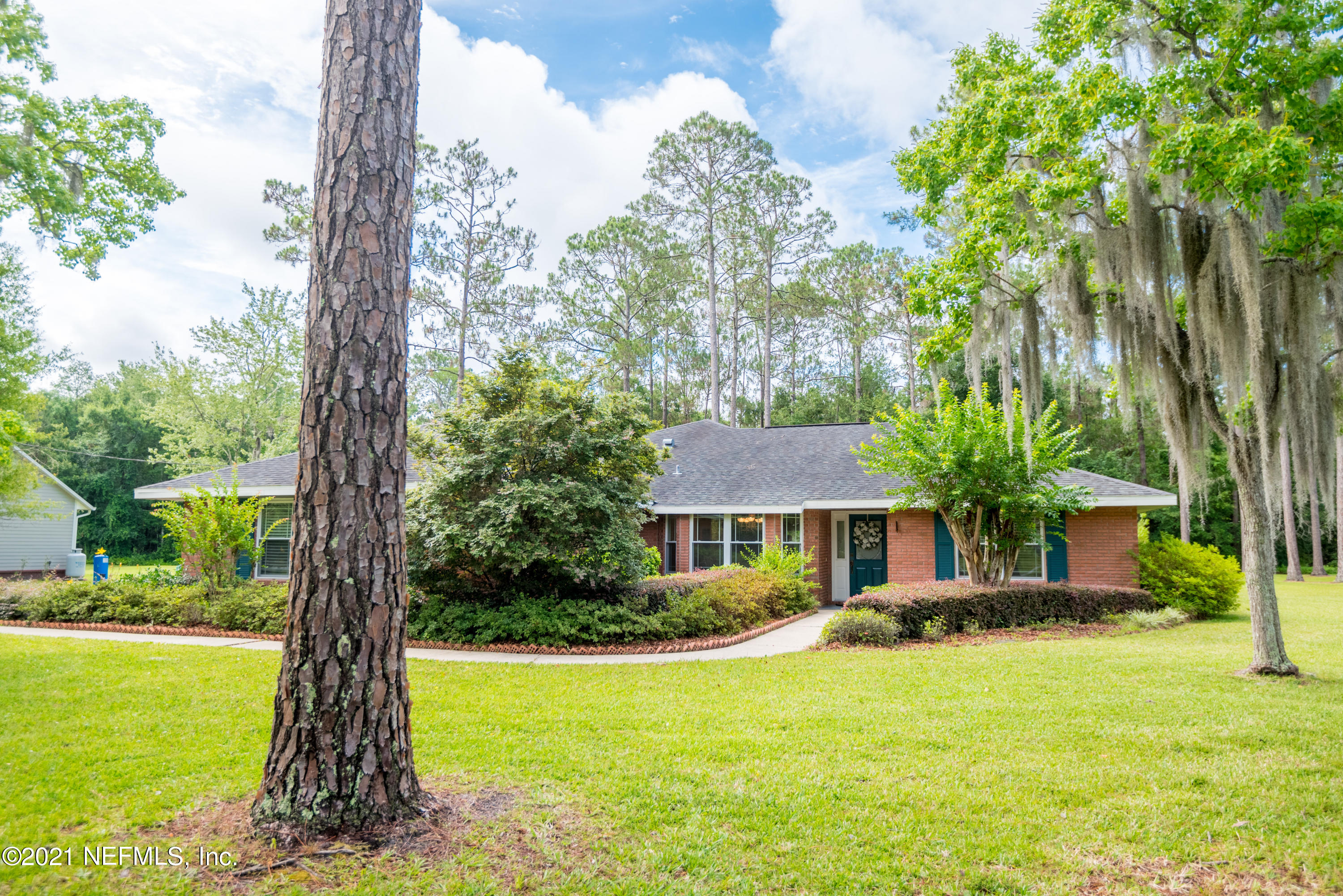 5200 Northwest 180th Way Starke, FL 32091 - Photo 72 of 83 a front view of a house with a yard
