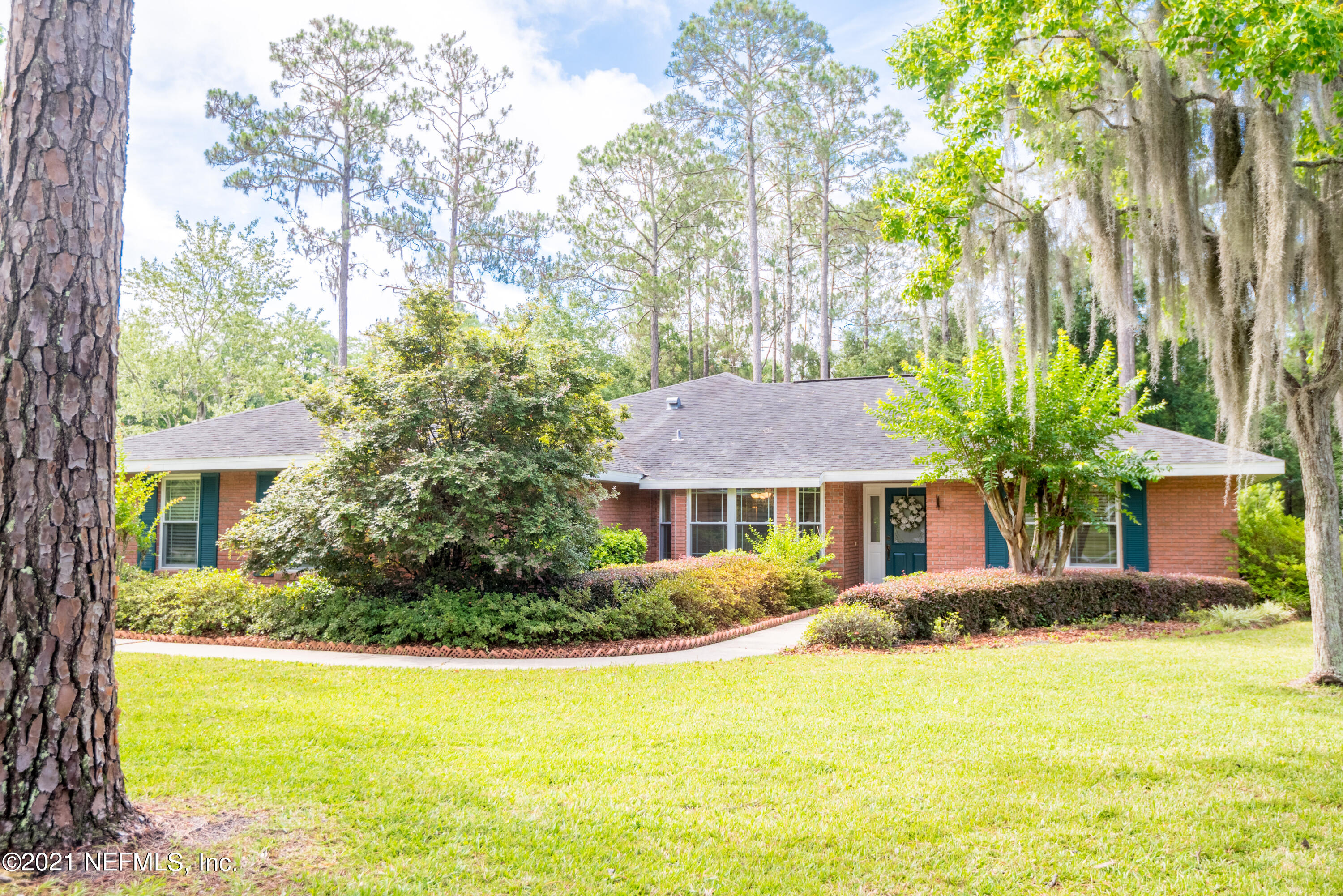 5200 Northwest 180th Way Starke, FL 32091 - Photo 73 of 83 a front view of a house with a yard and trees
