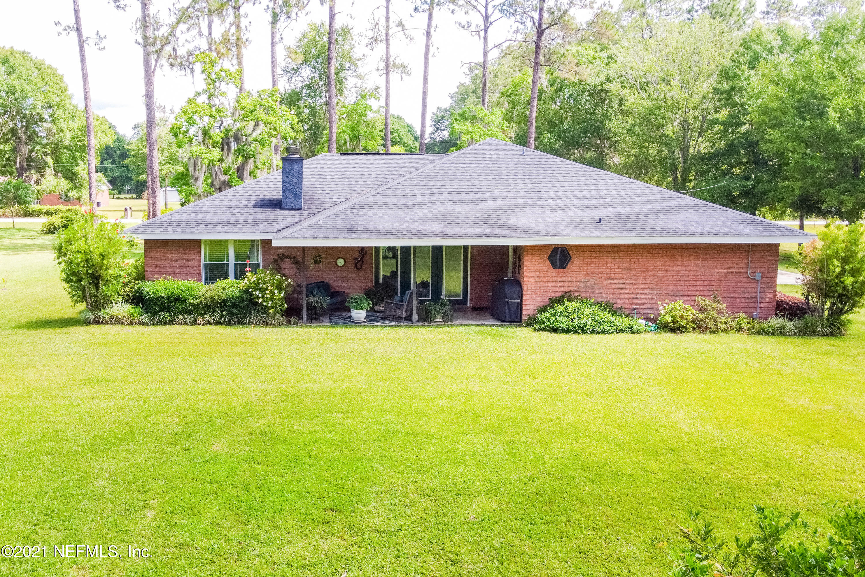 5200 Northwest 180th Way Starke, FL 32091 - Photo 80 of 83 a front view of house with swimming pool and green space