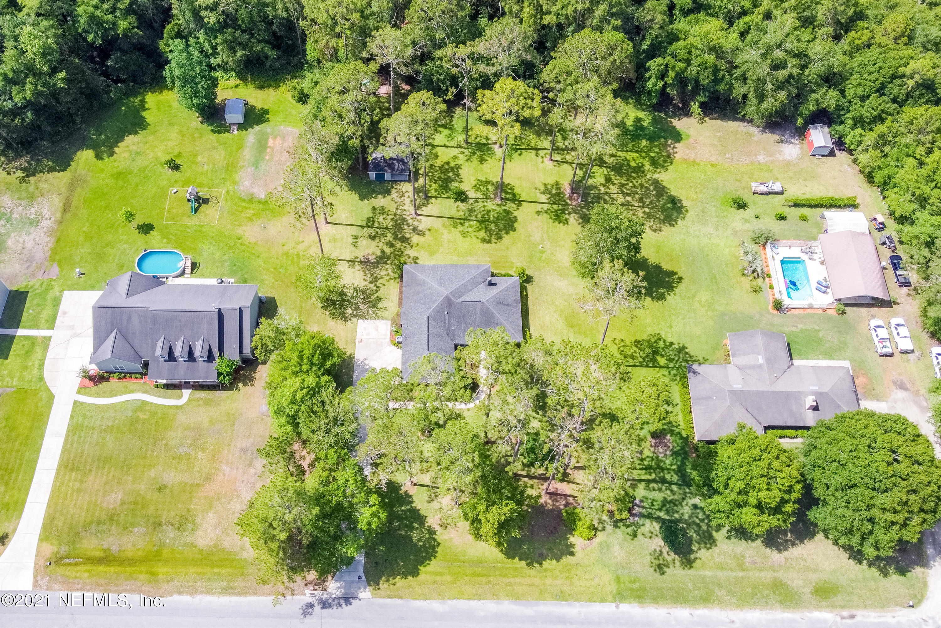 5200 Northwest 180th Way Starke, FL 32091 - Photo 83 of 83 an aerial view of house with yard swimming pool and outdoor seating