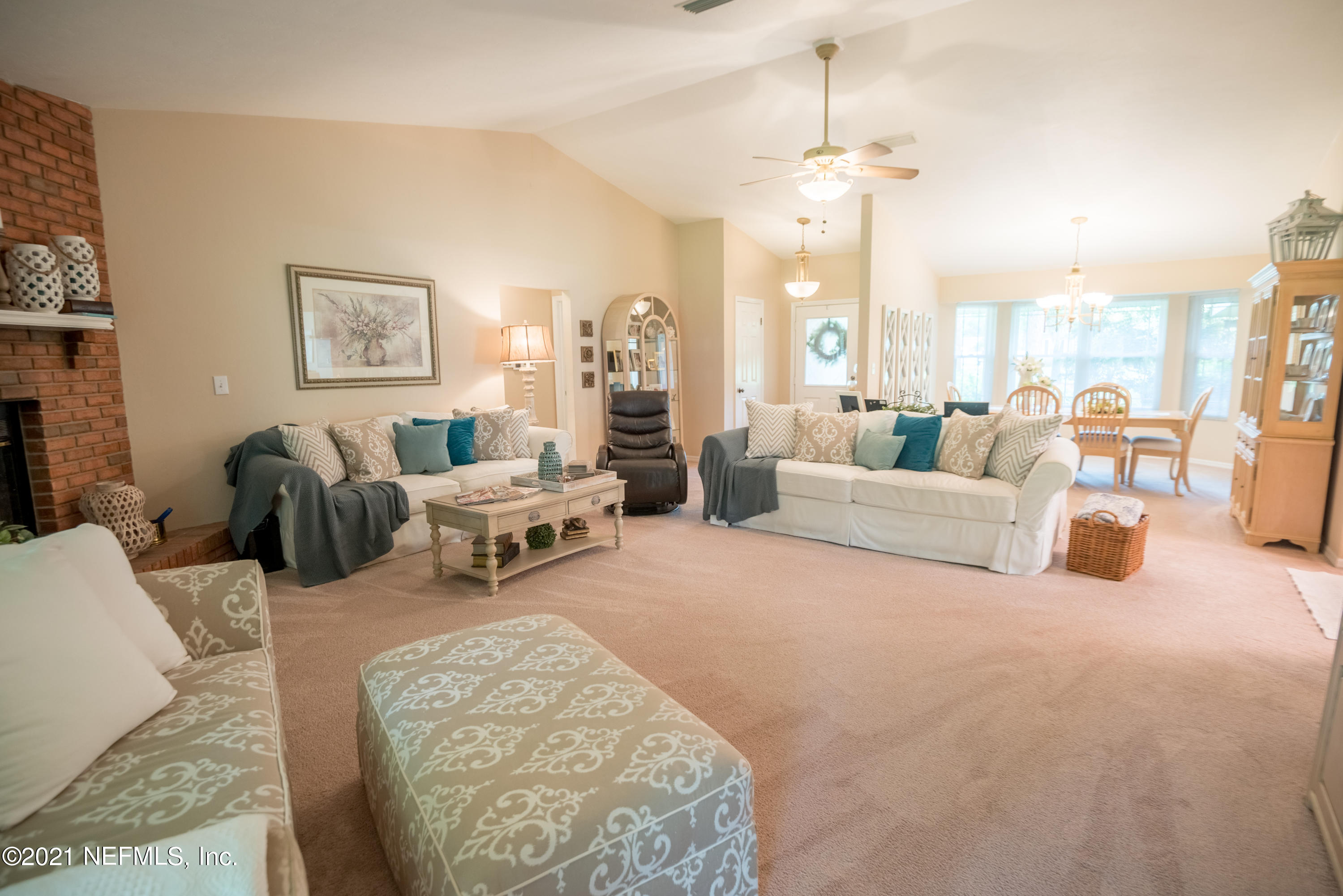5200 Northwest 180th Way Starke, FL 32091 - Photo 10 of 83 a living room with furniture and a chandelier