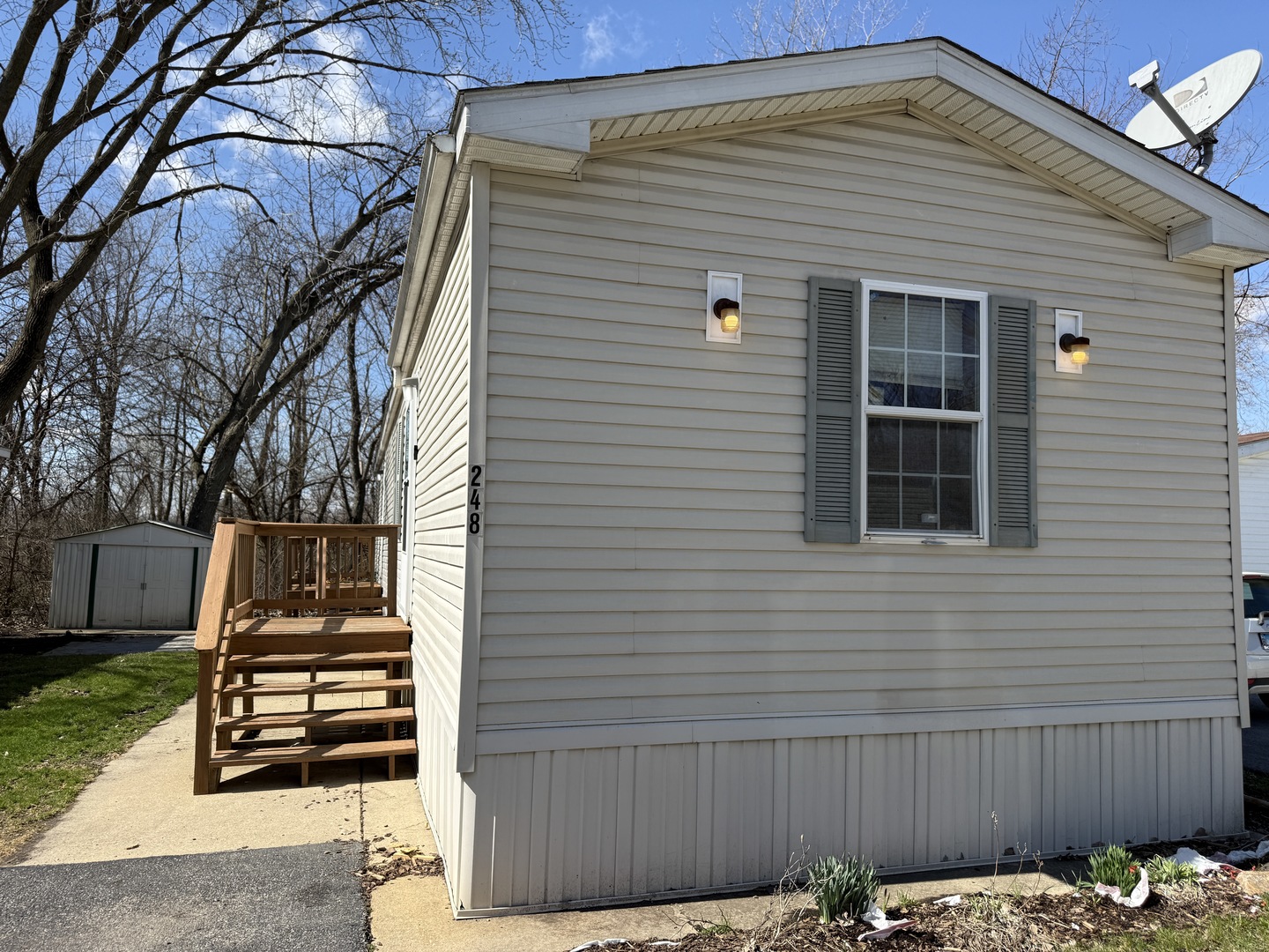 1712 South Dixie Highway, Unit 248 Crete, IL 60417 - Photo 1 of 19 a front view of a house with plants