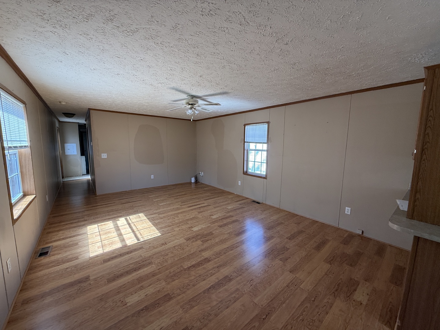 1712 South Dixie Highway, Unit 248 Crete, IL 60417 - Photo 12 of 19 a view of empty room with window and wooden floor