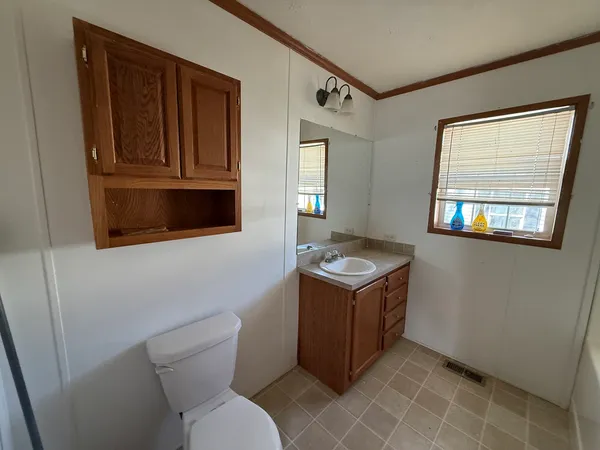 a room with a stove and a microwave