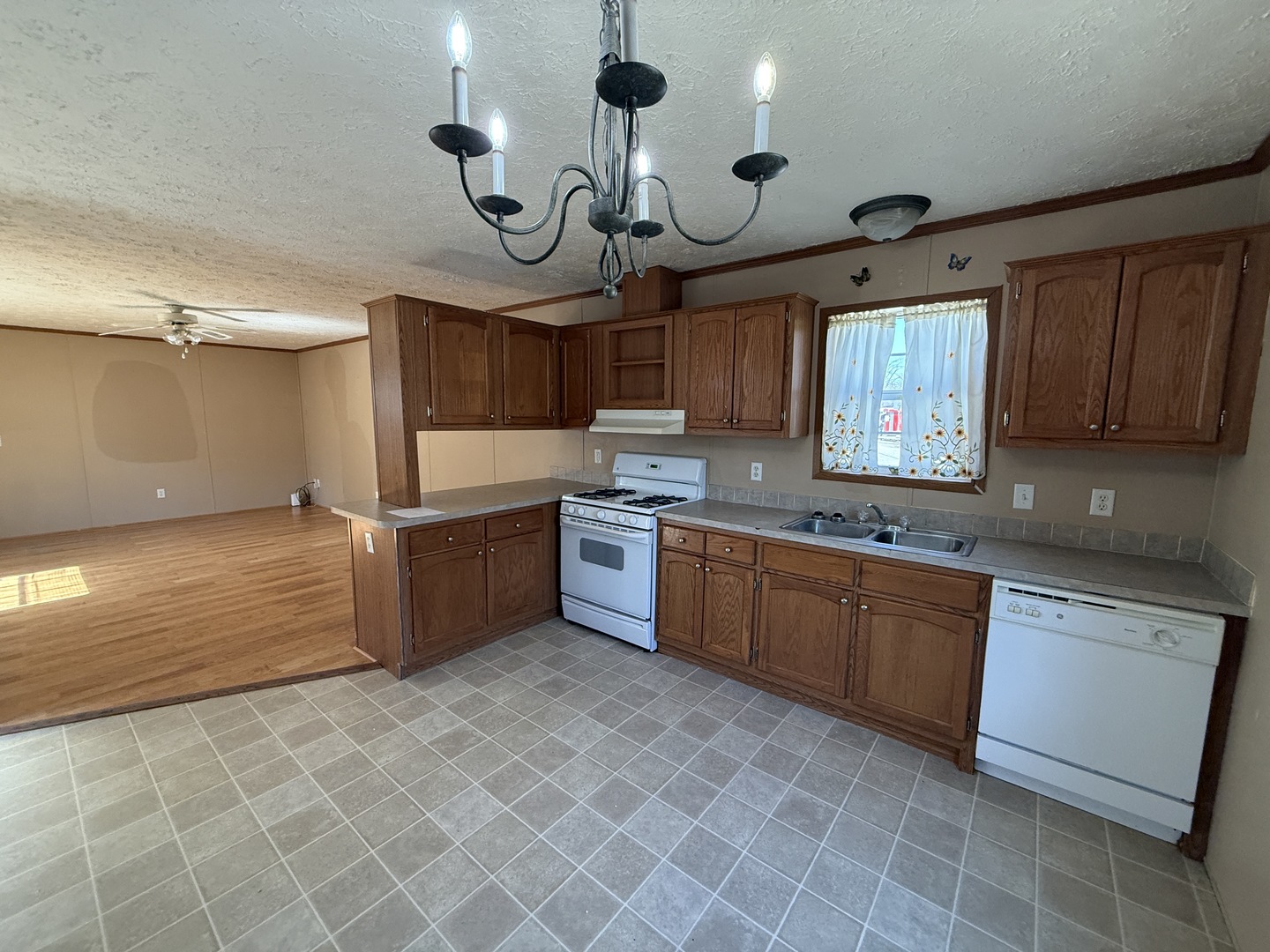 1712 South Dixie Highway, Unit 248 Crete, IL 60417 - Photo 8 of 19 a kitchen with cabinets a sink and appliances